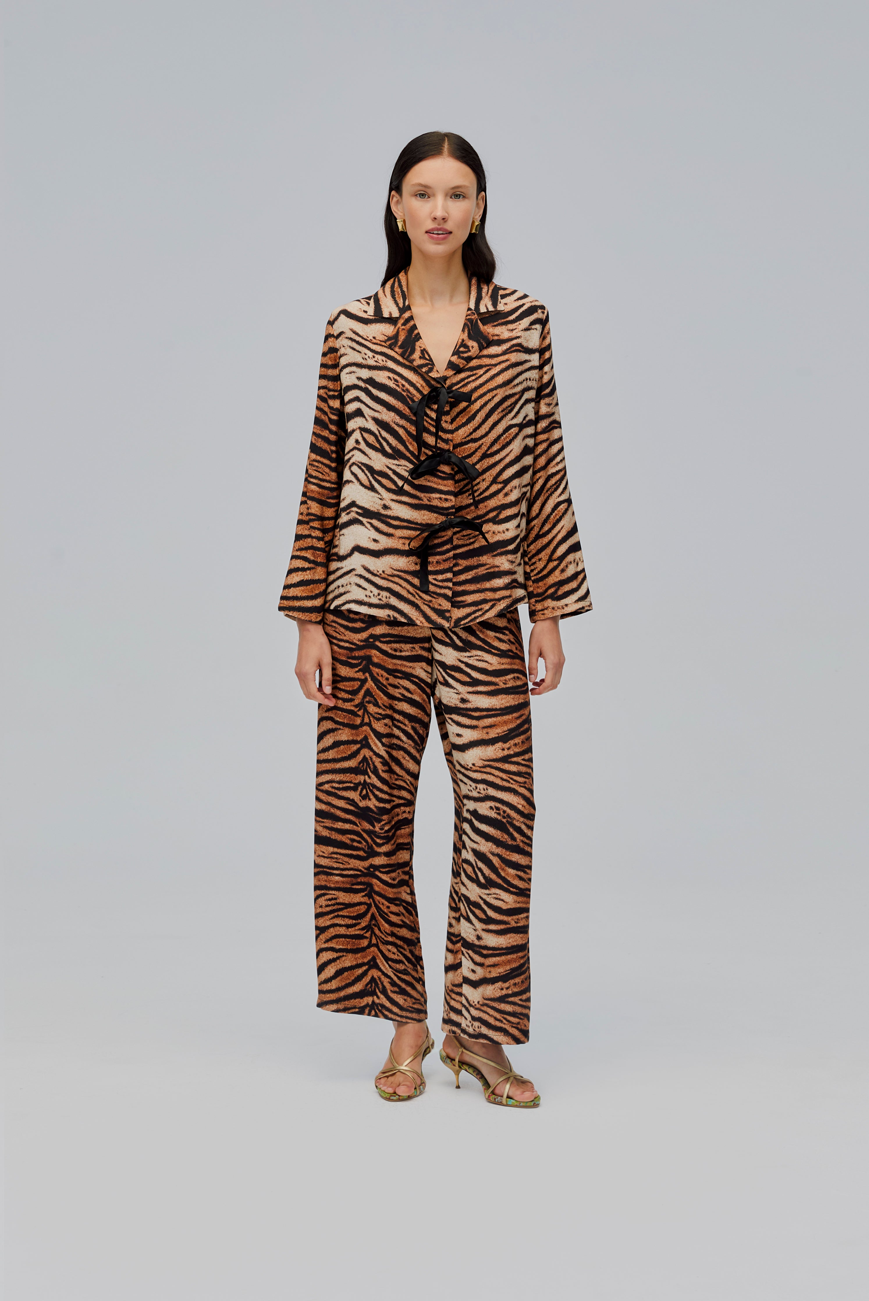 woman-wearing-tiger-print-pyjama-long-sleeve-shirt-and-pants-three-bow-ties
