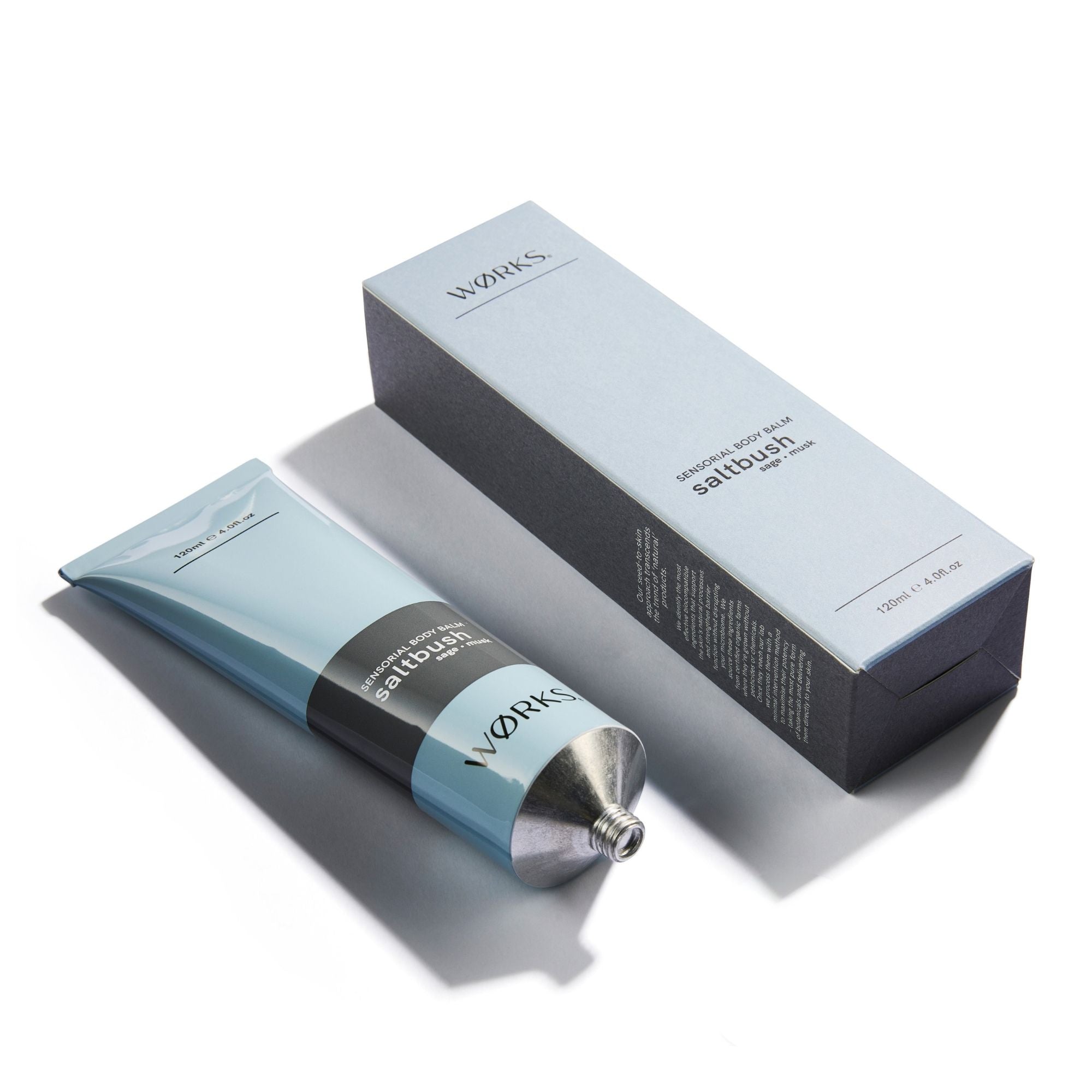 Blue skincare product tube and rectangular blue box with 'WORKS' branding.