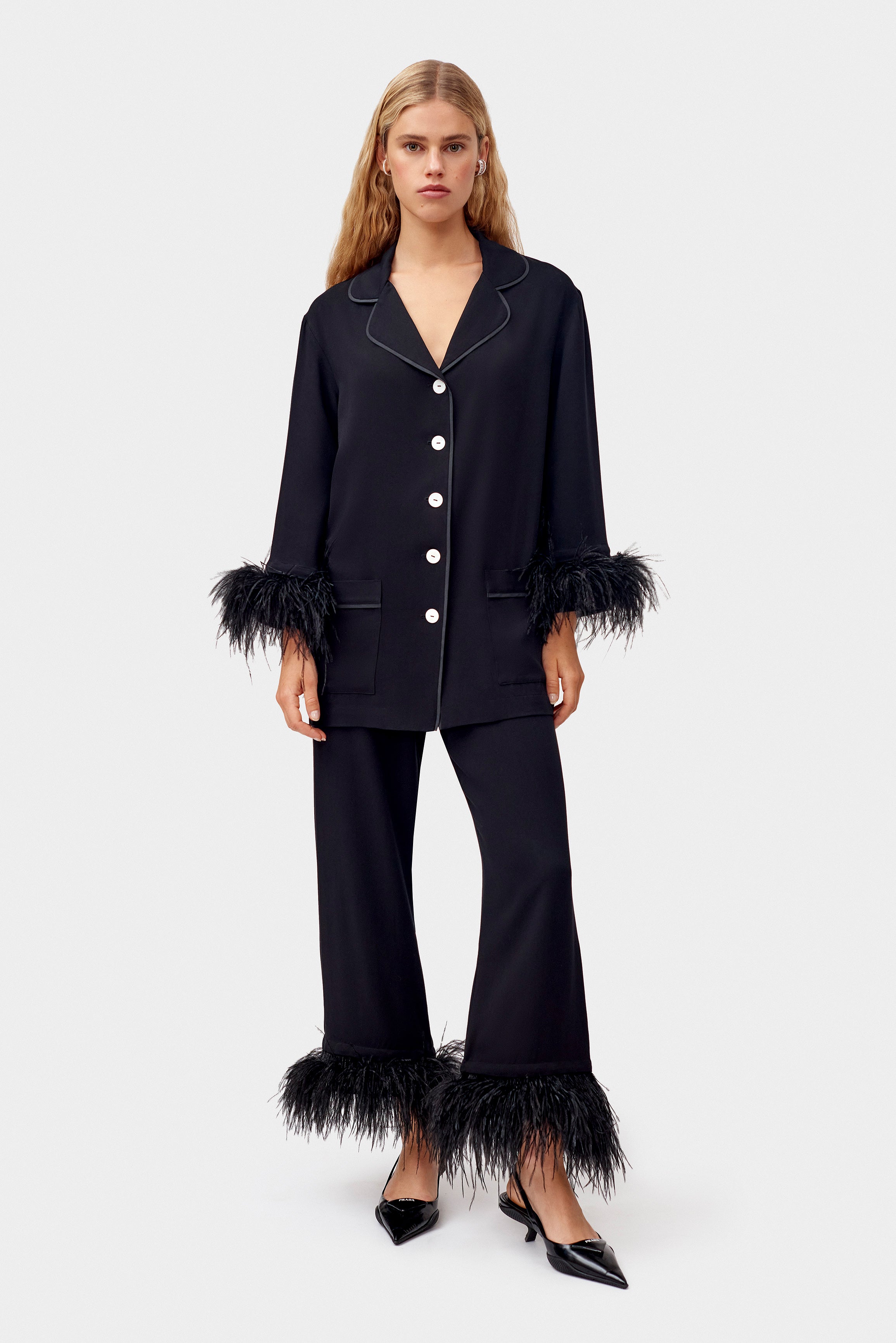 woman-standing-wearing-black-party-pyjamas-and-shoes