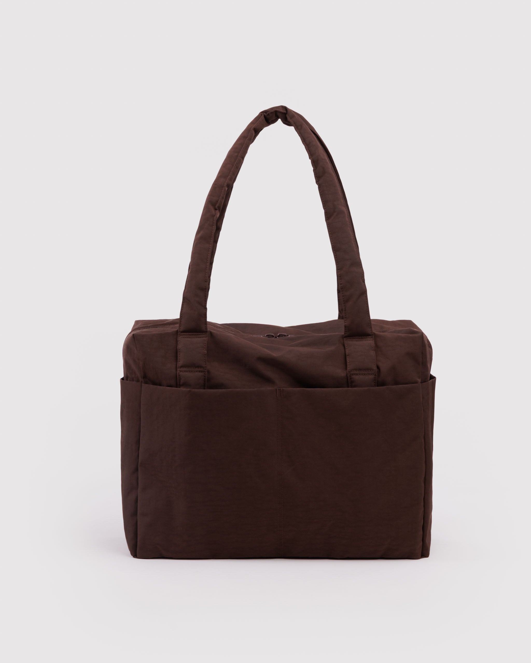 Brown tote bag with carry handles and outside pockets.