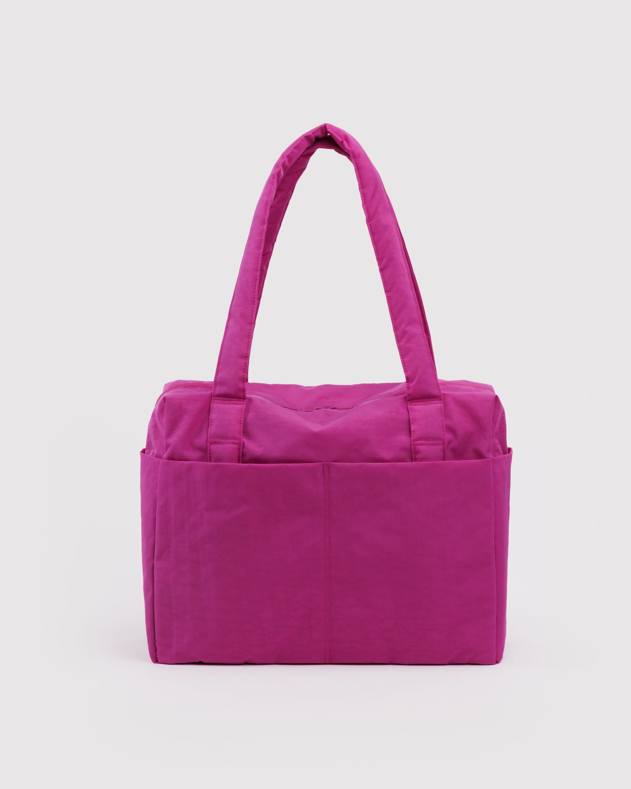 Vibrant pink tote bag with carry handles and outside pockets.