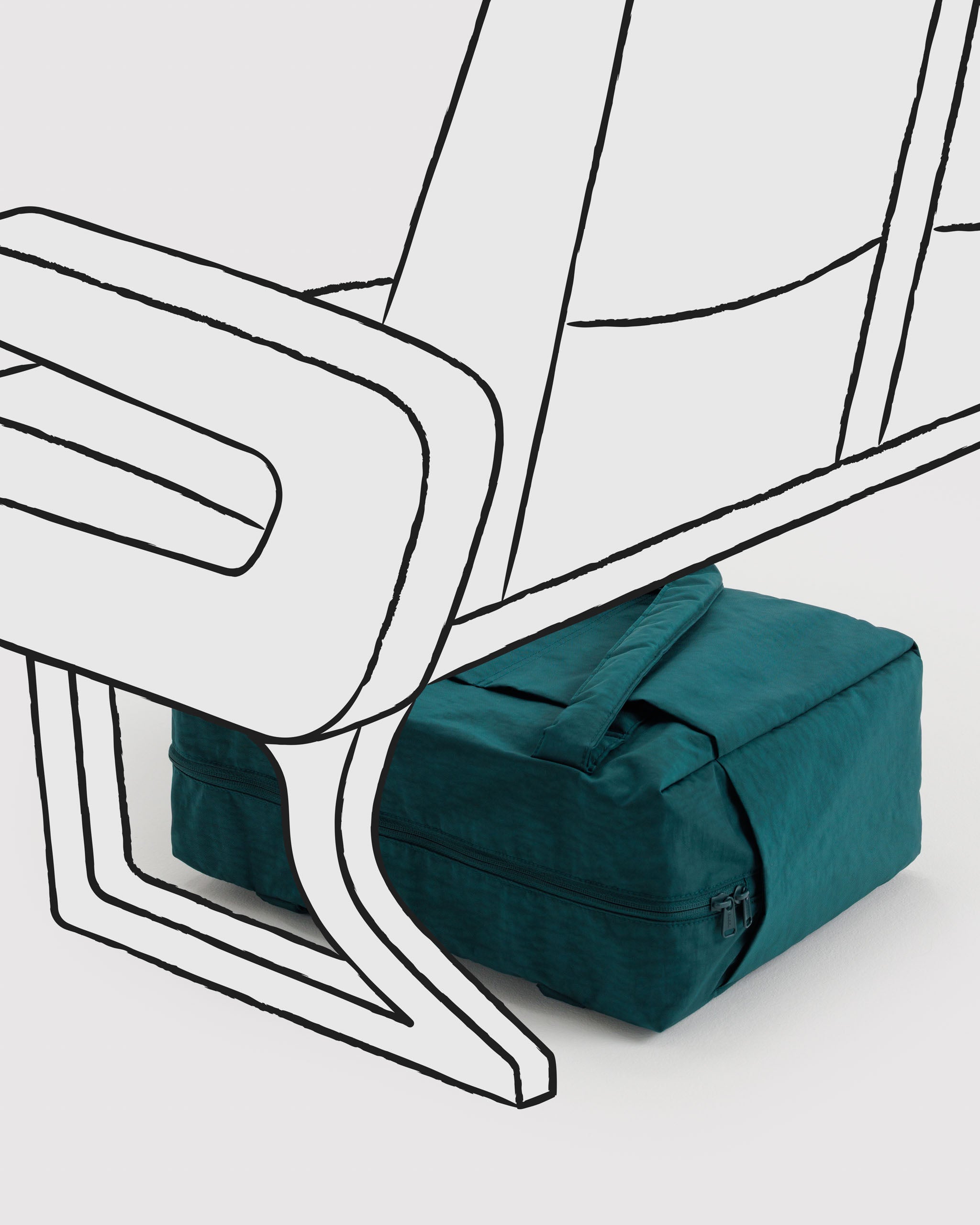 Teal bag under a white airplane seat.