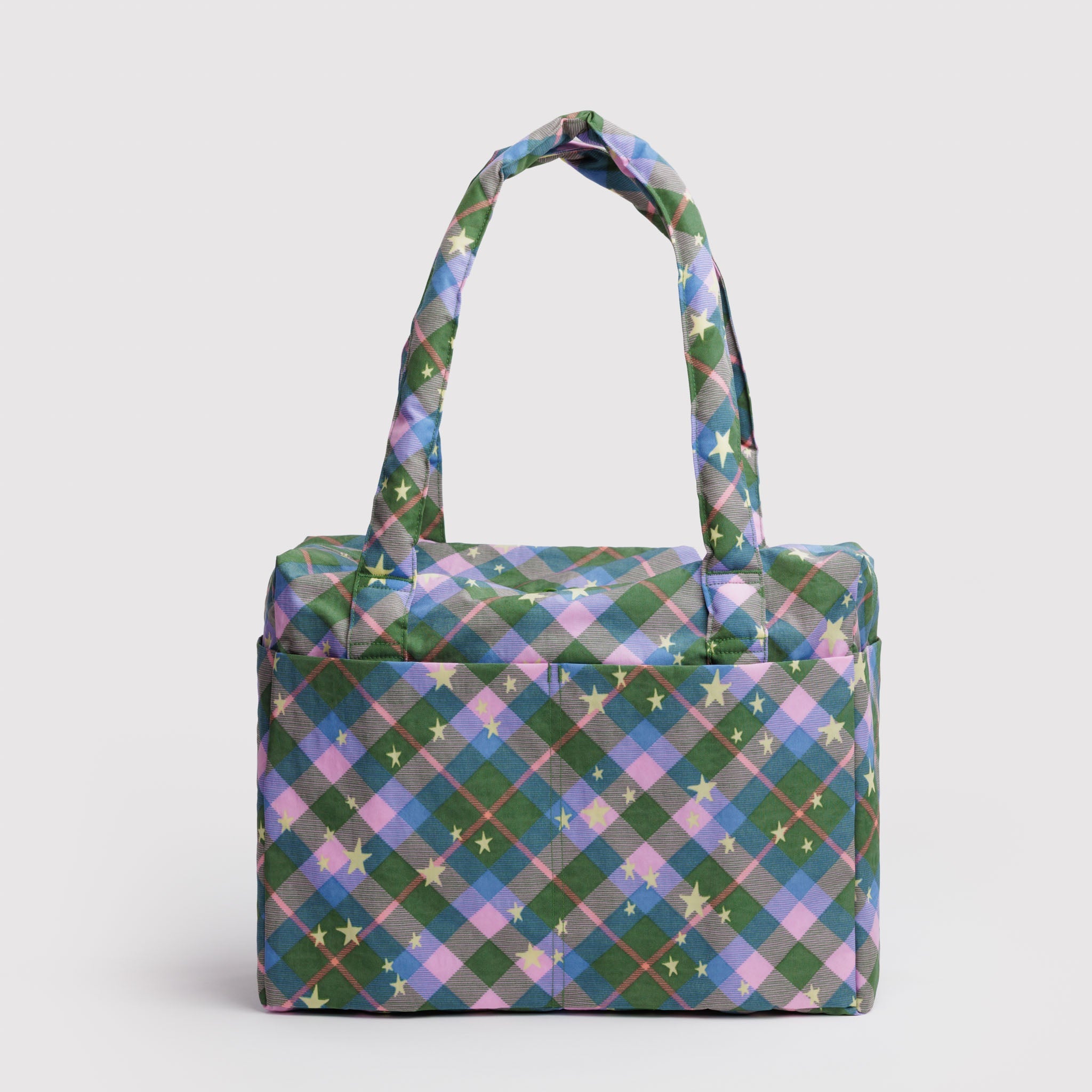 Green plaid duffle bag with star patterns, carry handles and zip top with outside deep pouches.