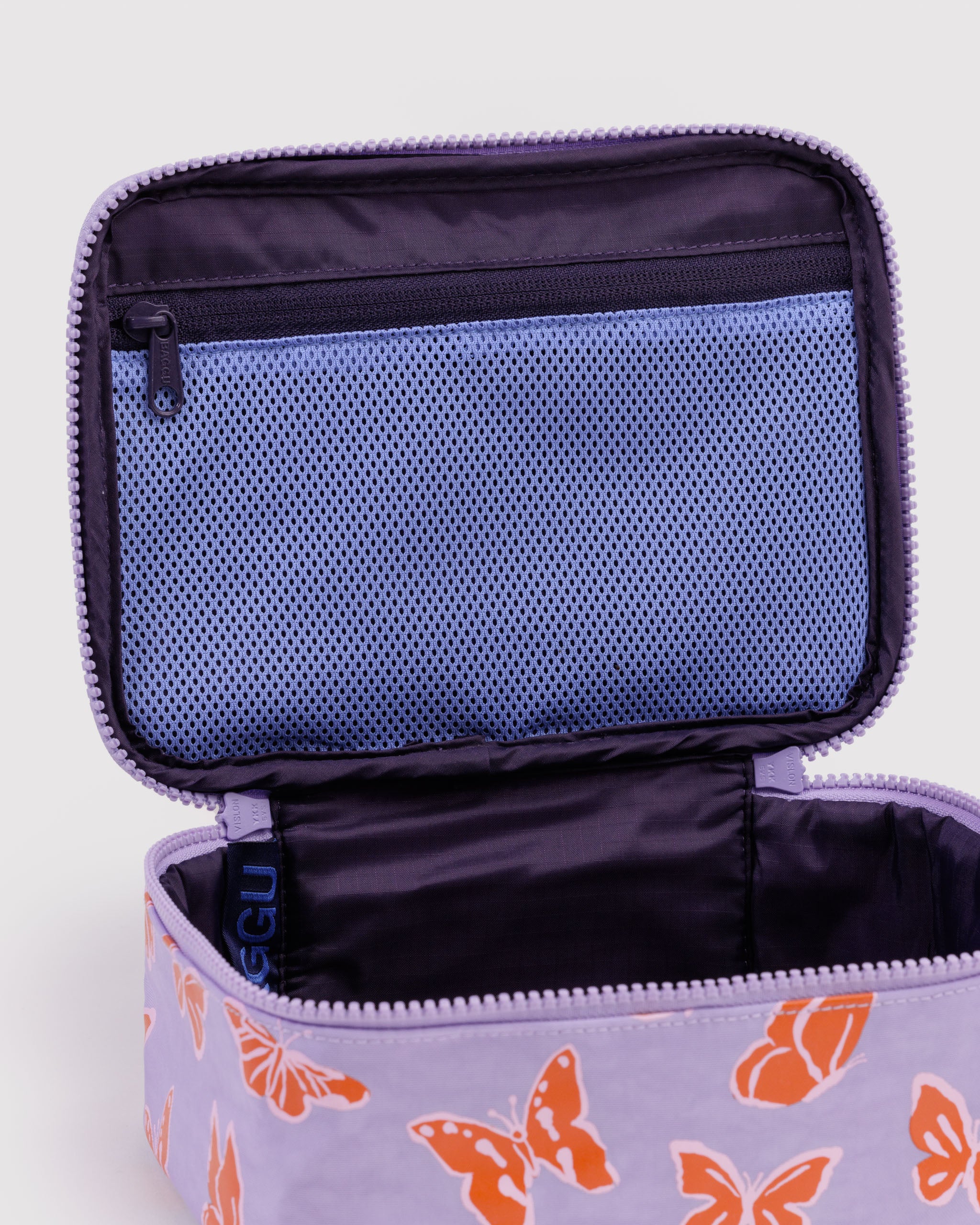 Open purple cosmetic bag with butterfly pattern with zip pouchon inide lid.