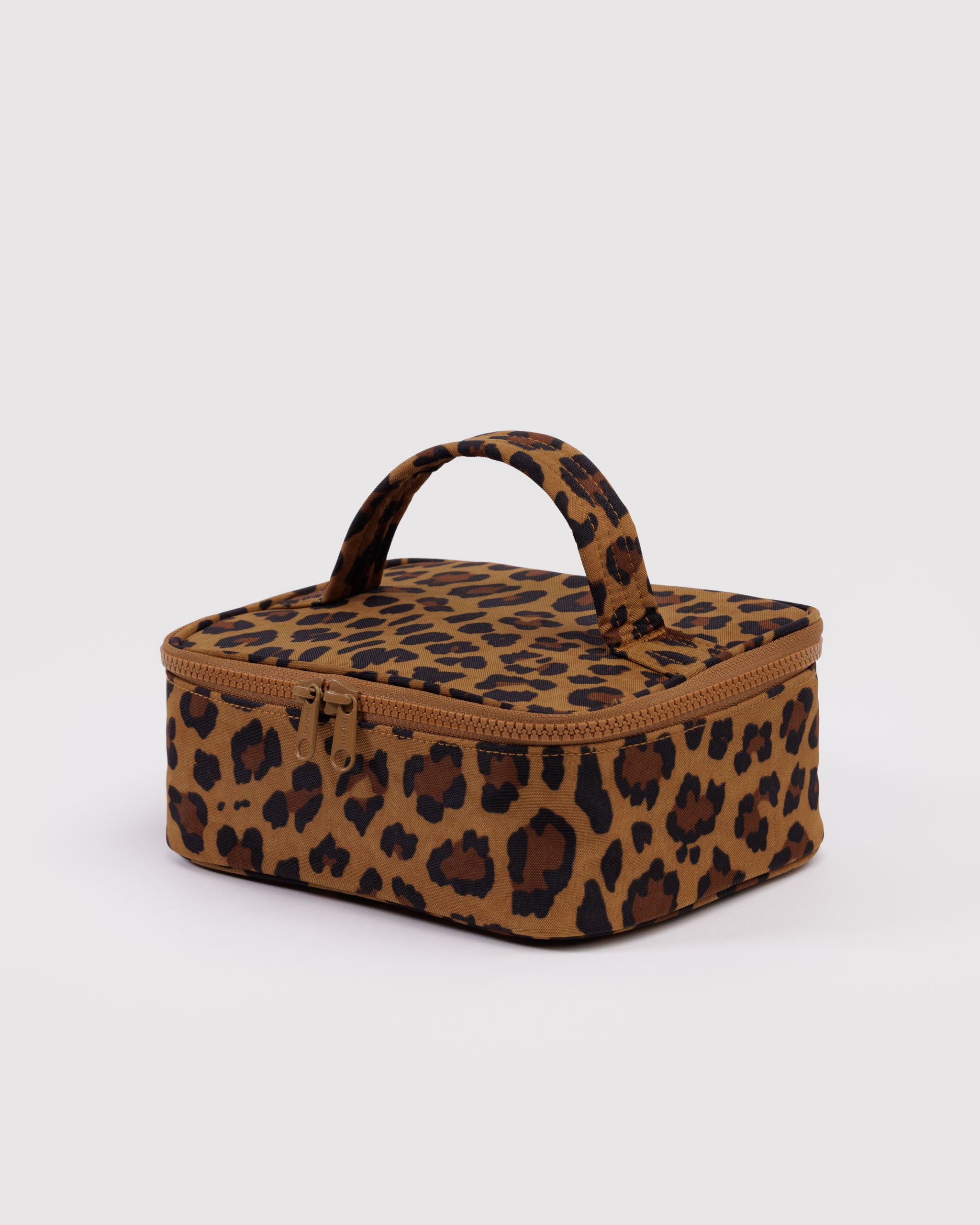 Leopard print makeup bag, zip top closure and carry handle.