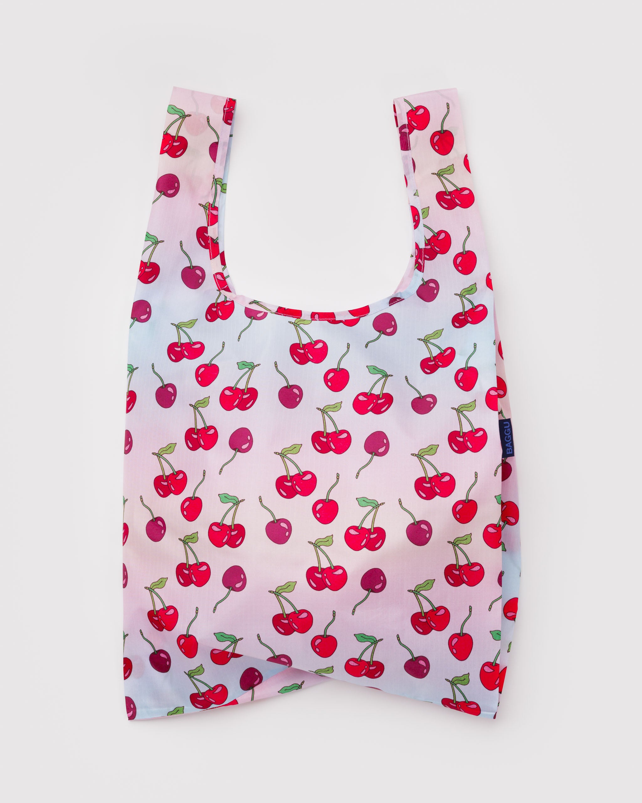 Reusable shopping tote bag with cherry pattern.