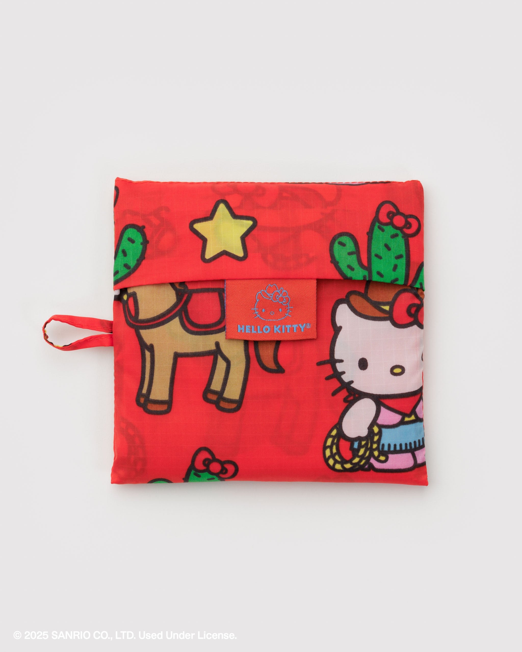 Foldable red pouch with hanging loop in Hello Kitty, a horse, cactus and star western design.