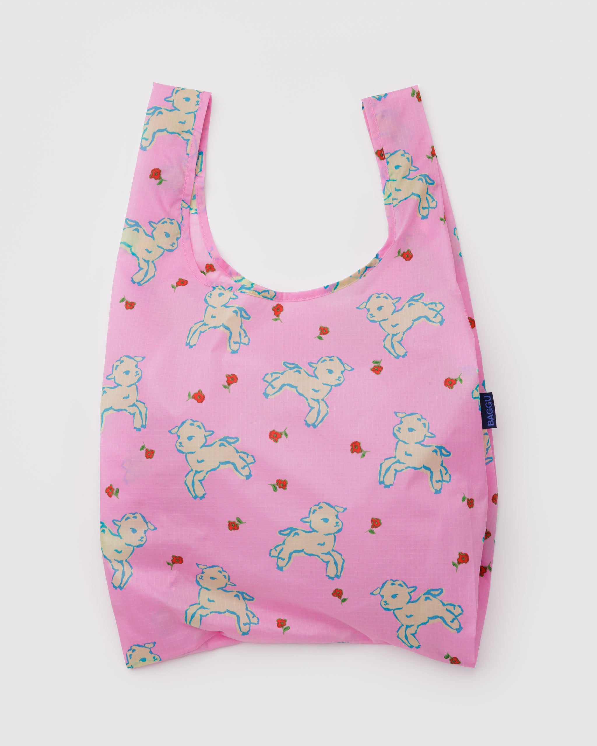 Pink reusable bag with white lamb pattern and small red flower.