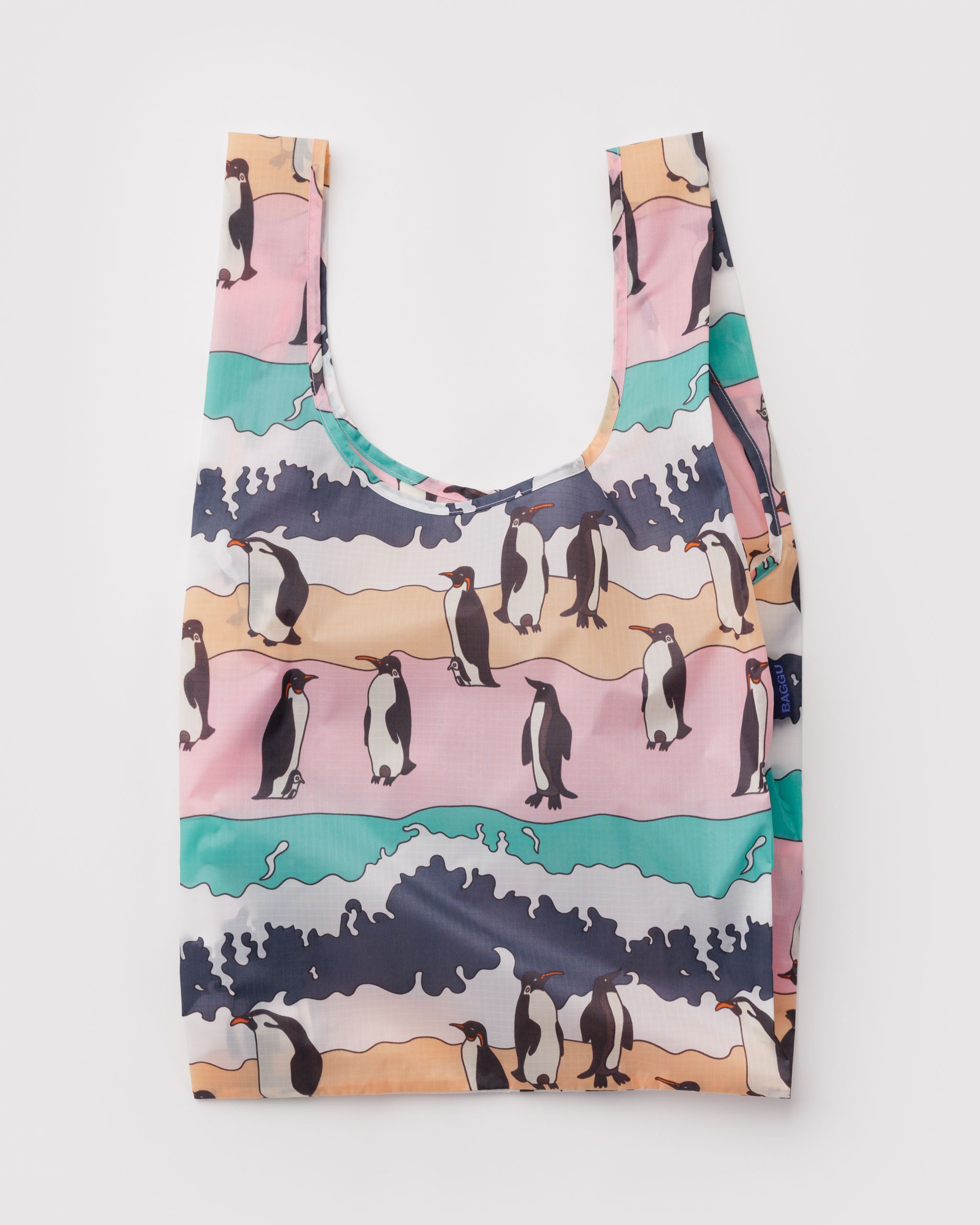 Reusable bag with penguin design on a multi-coloured background