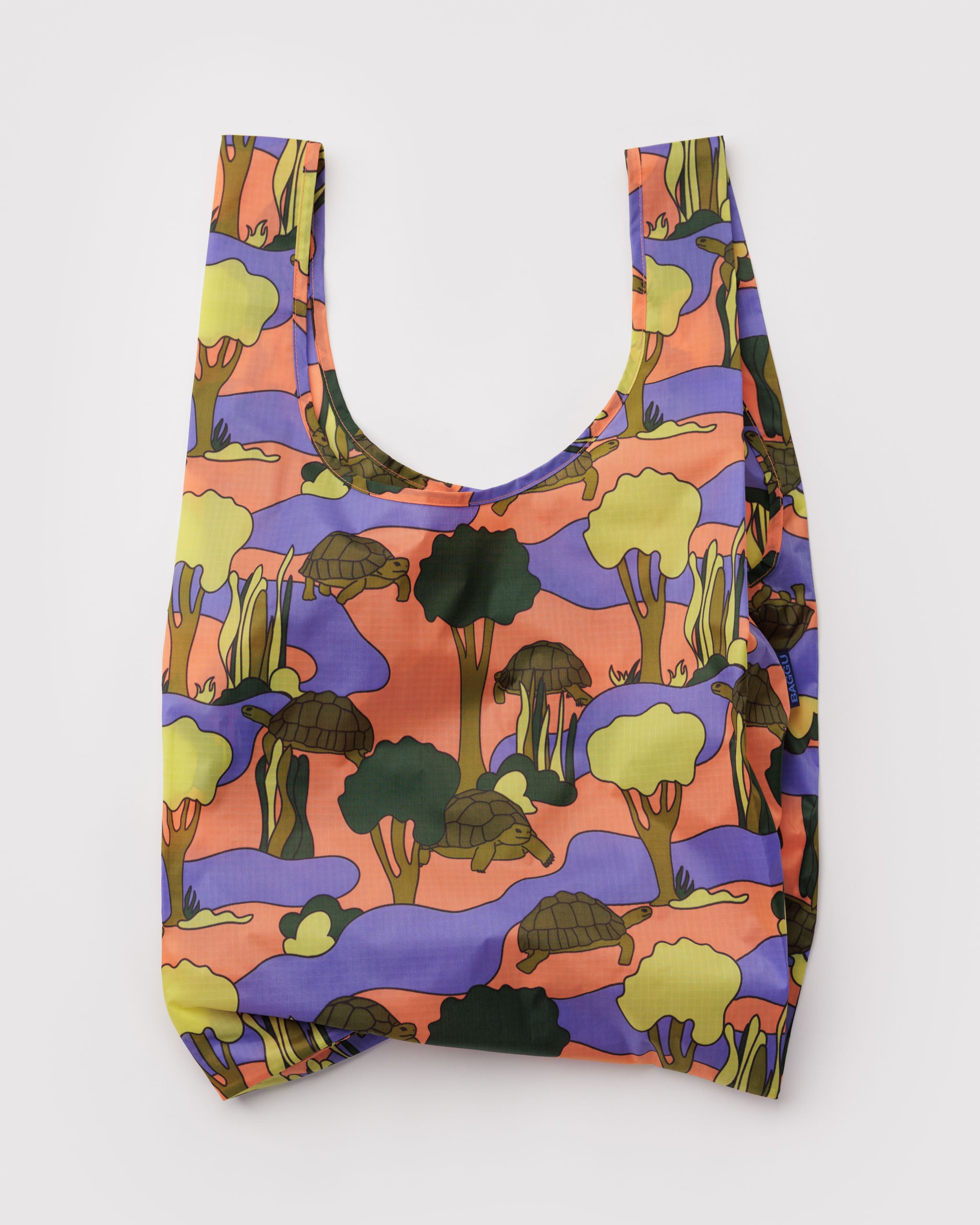 Reusable bag with a colourful forest and turtle pattern 