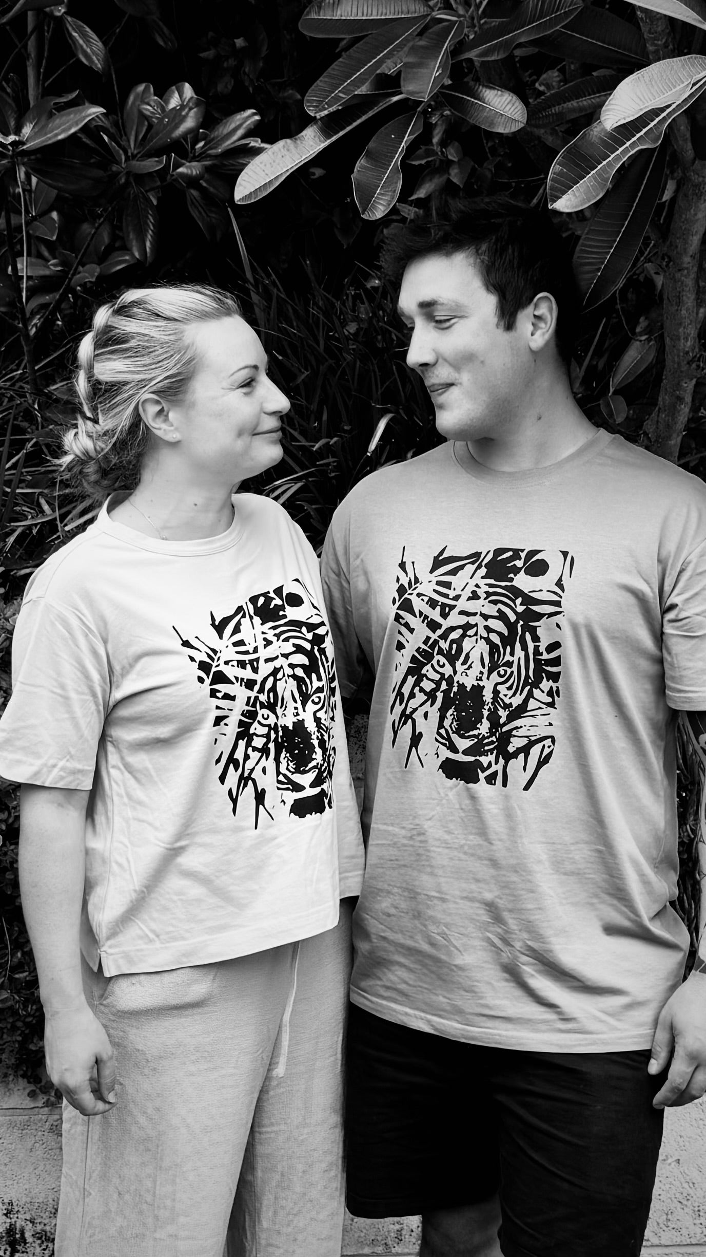 man-and-woman-wearing-tiger-t-shirts-black-and-white-photo