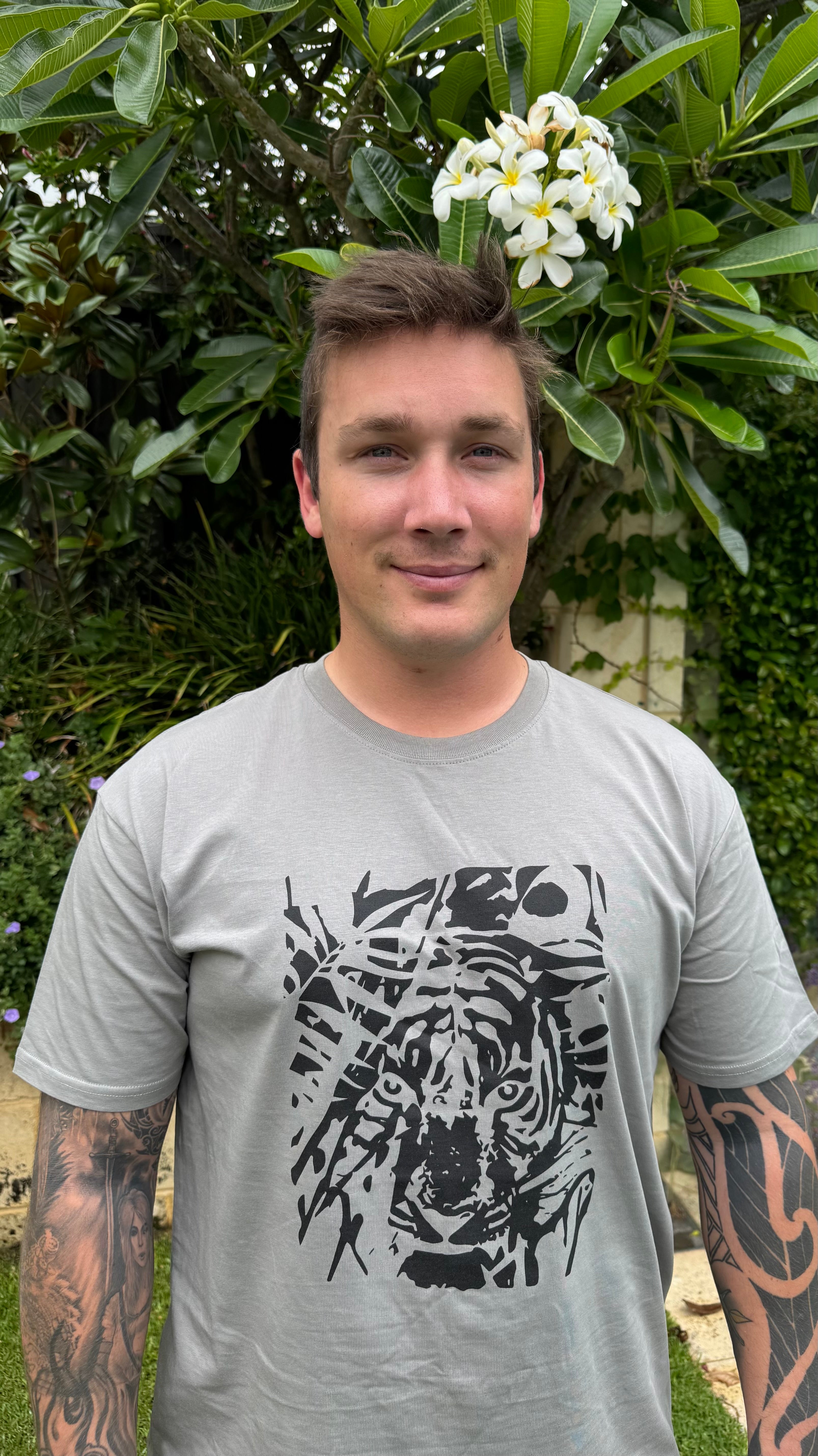 man-wearing-granite-t-shirt-with-black-tiger-tropical-screenprint