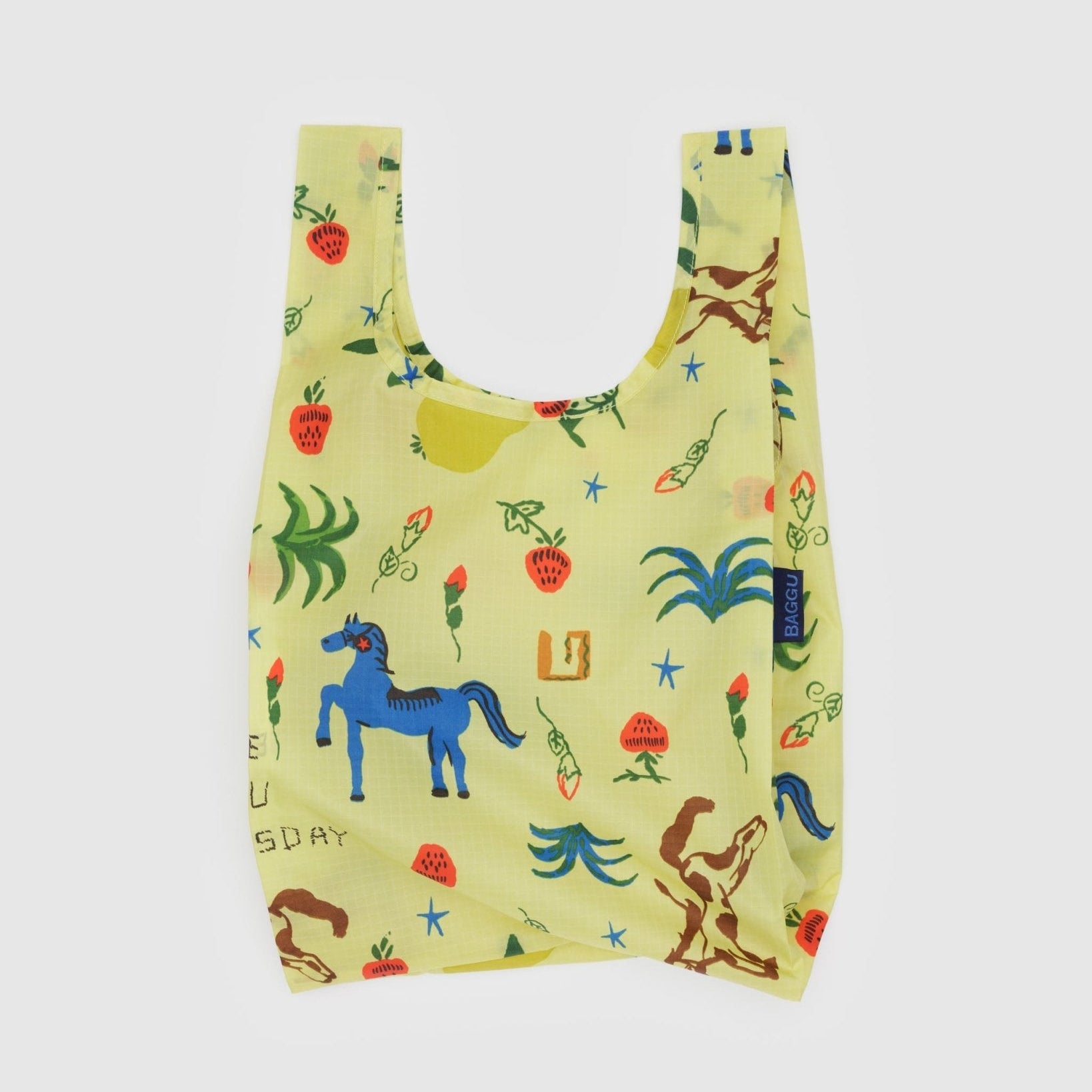 Reusable bag with colourful horse and plant pattern on a light yellow background.