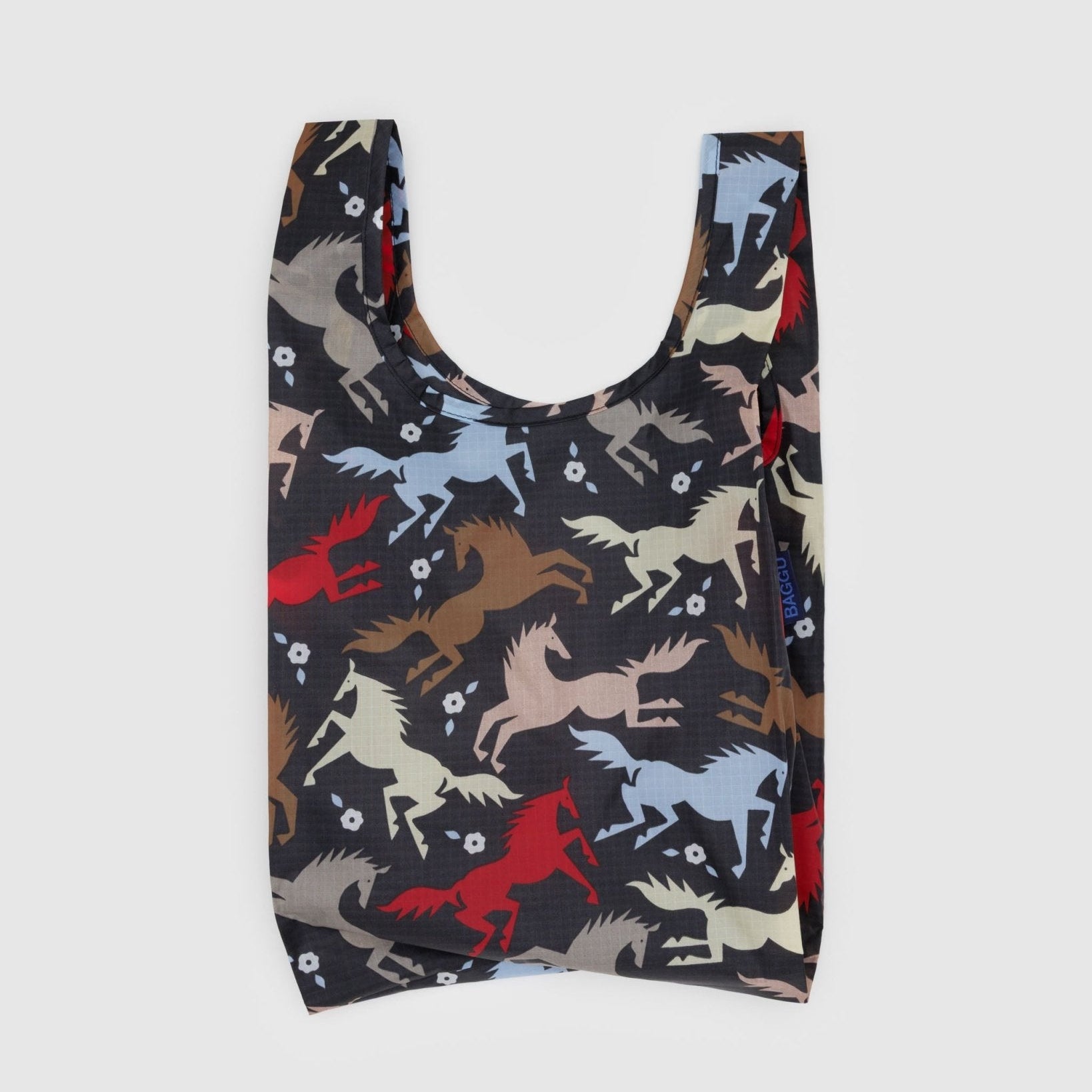 Baby size reusable shopping bag with coloured horses and white flower pattern on black nylon.