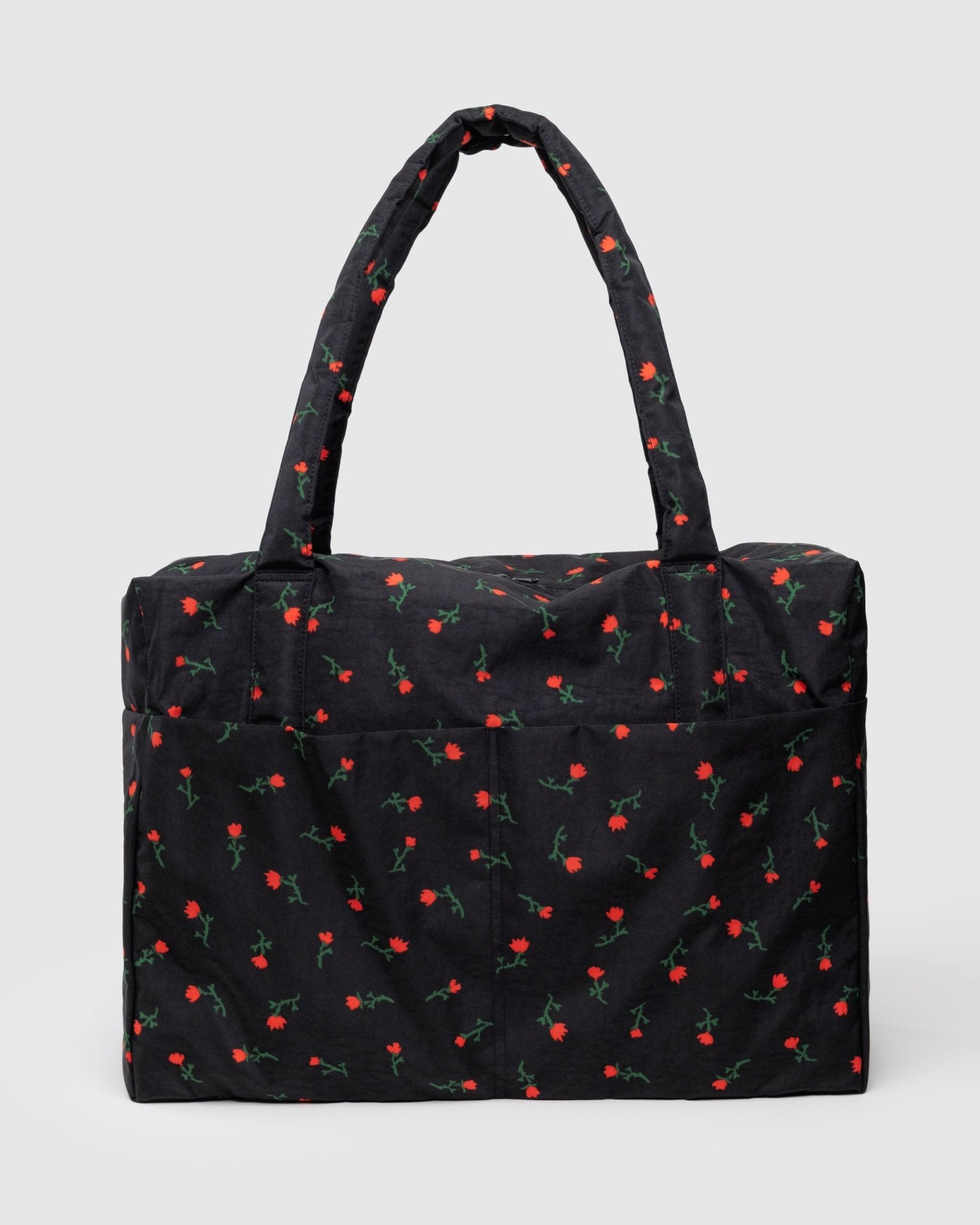 
Large black duffle bag with red floral pattern, carry handles and front pockets