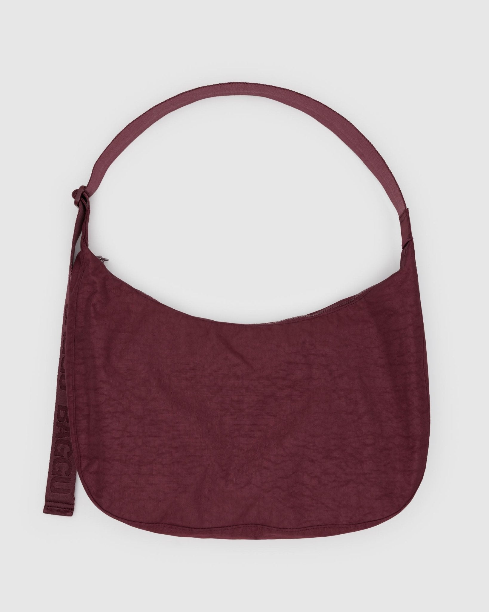 Maroon shoulder bag with adjustable shoulder strap and zip top