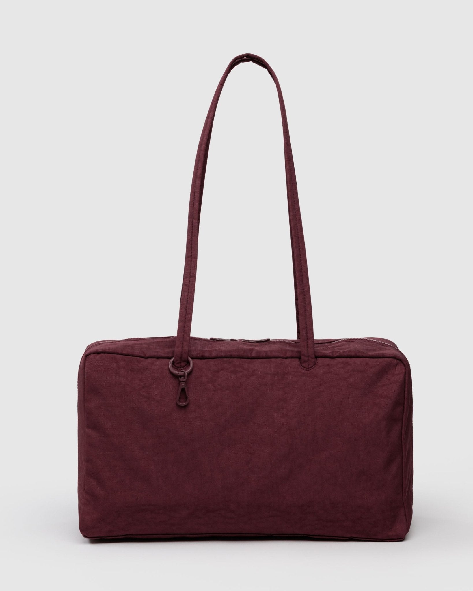 Maroon handbag with metal charm clips on double handles