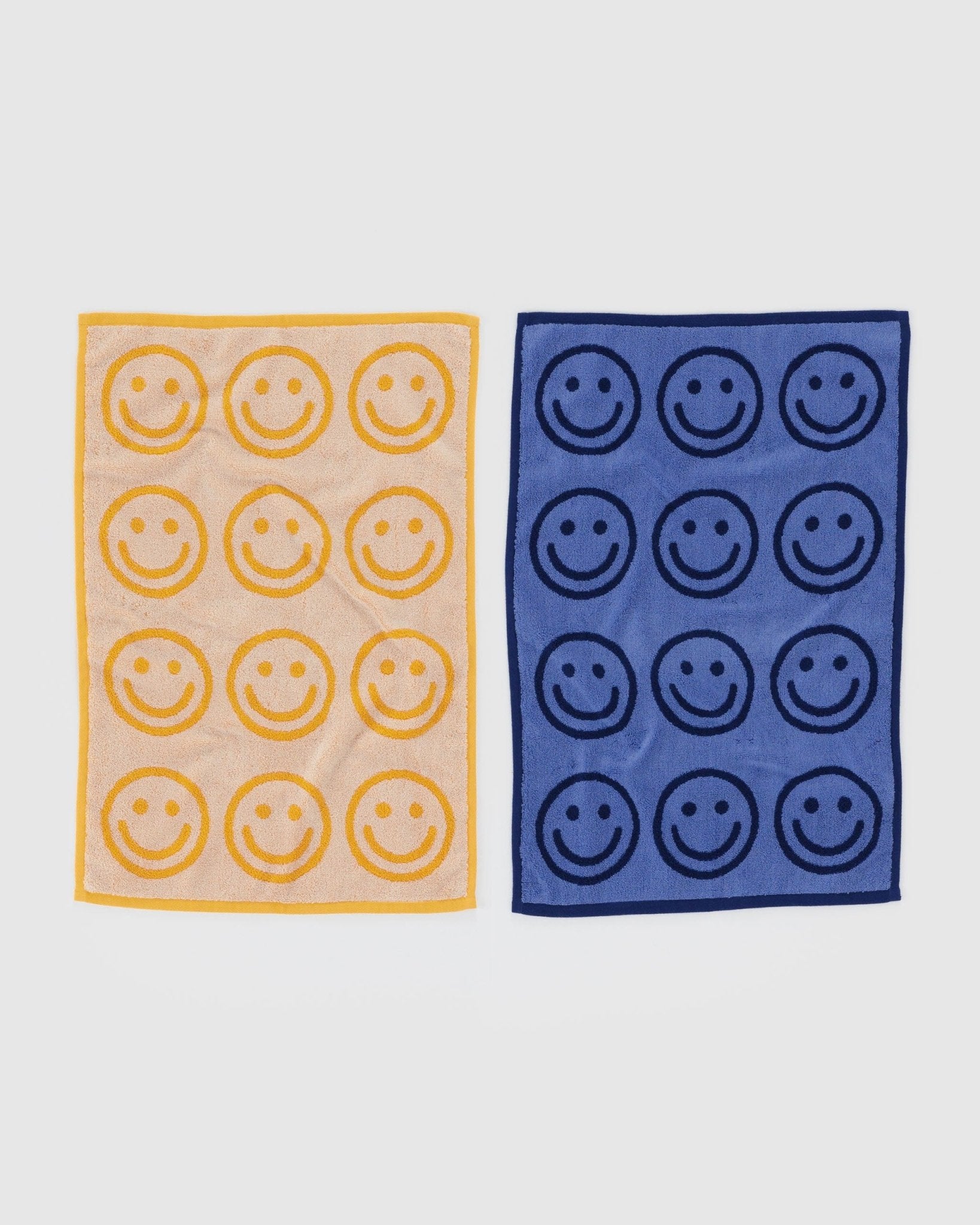 front of blue and yellow towel set with smiley face print