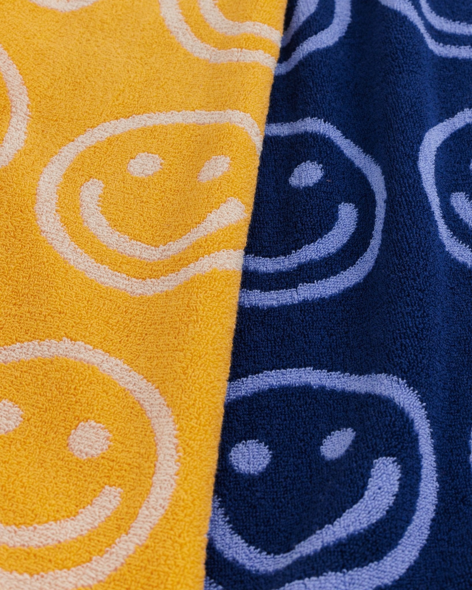 Baggu Reversible Hand Towel Set of 2 in Happy Blue Marigold colour with smiley face print