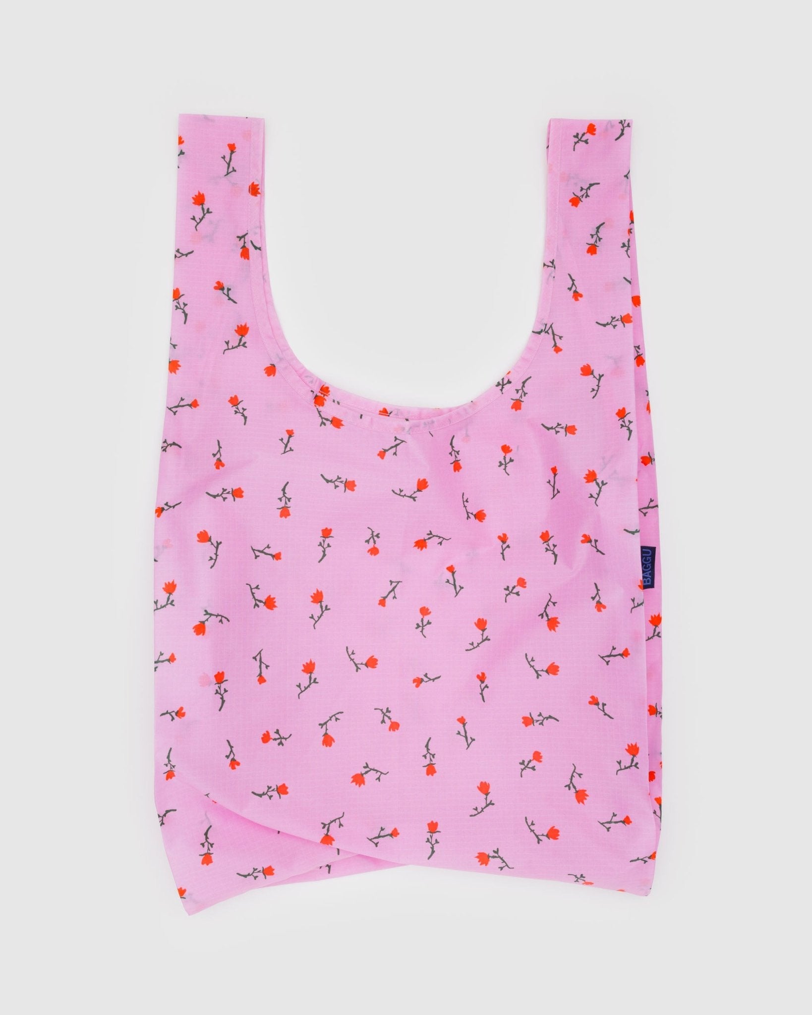 Standard size Pink reusable bag with floral pattern and BAGGU tag