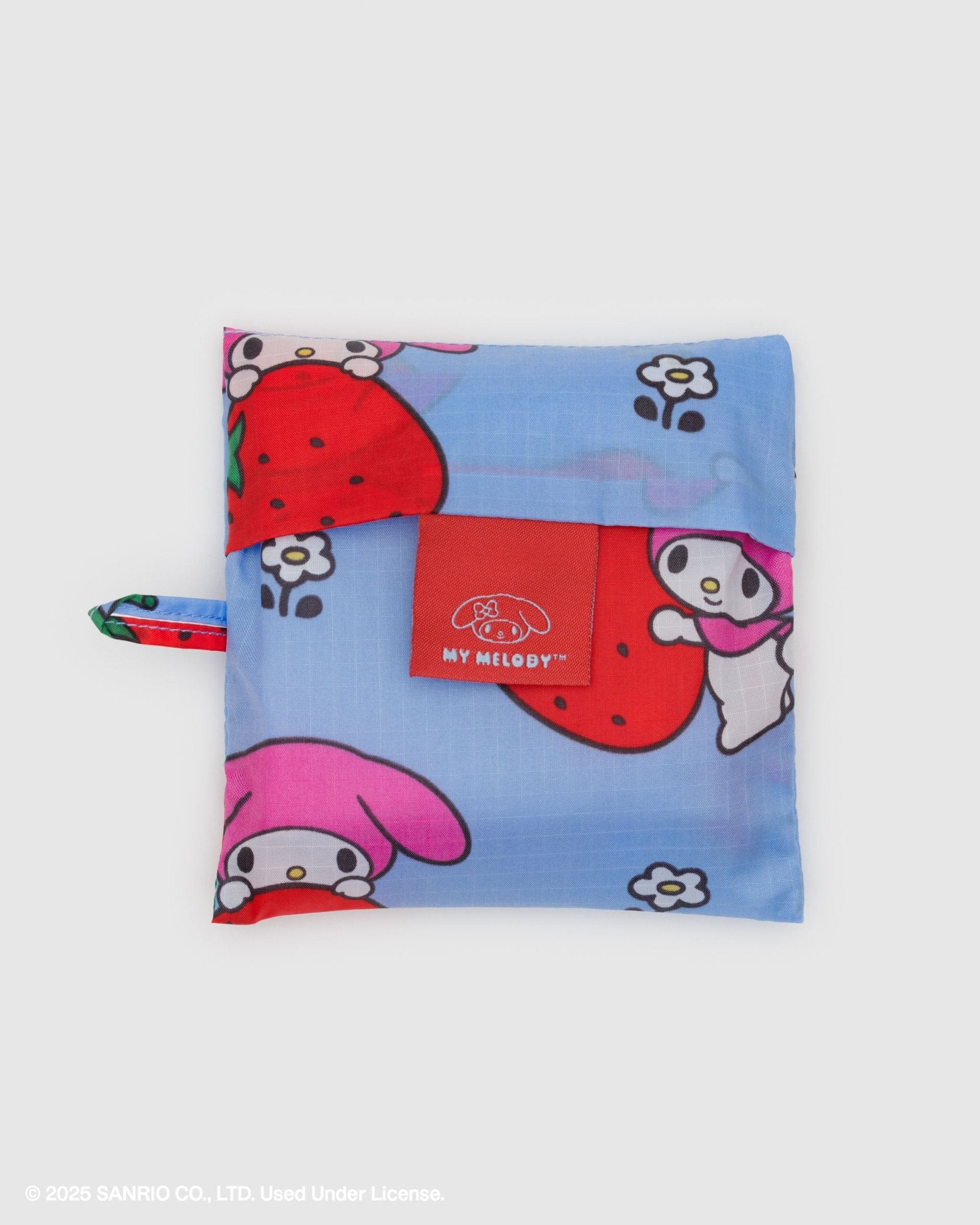 white rabbit holding a strawberry Cartoon-themed print on blue standard baggu storage pouch with loop at side
