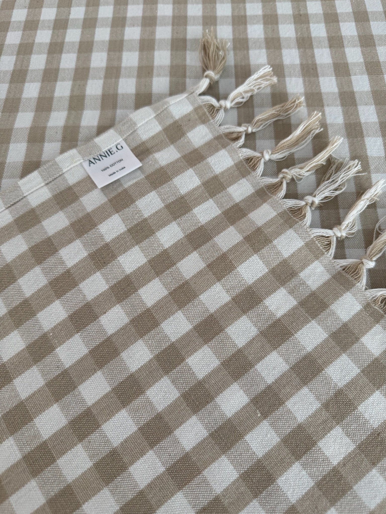 Checkered bone and white Gingham Cotton Tablecloth with fringe ends and hemmed sides with brand label - ANNIE.G