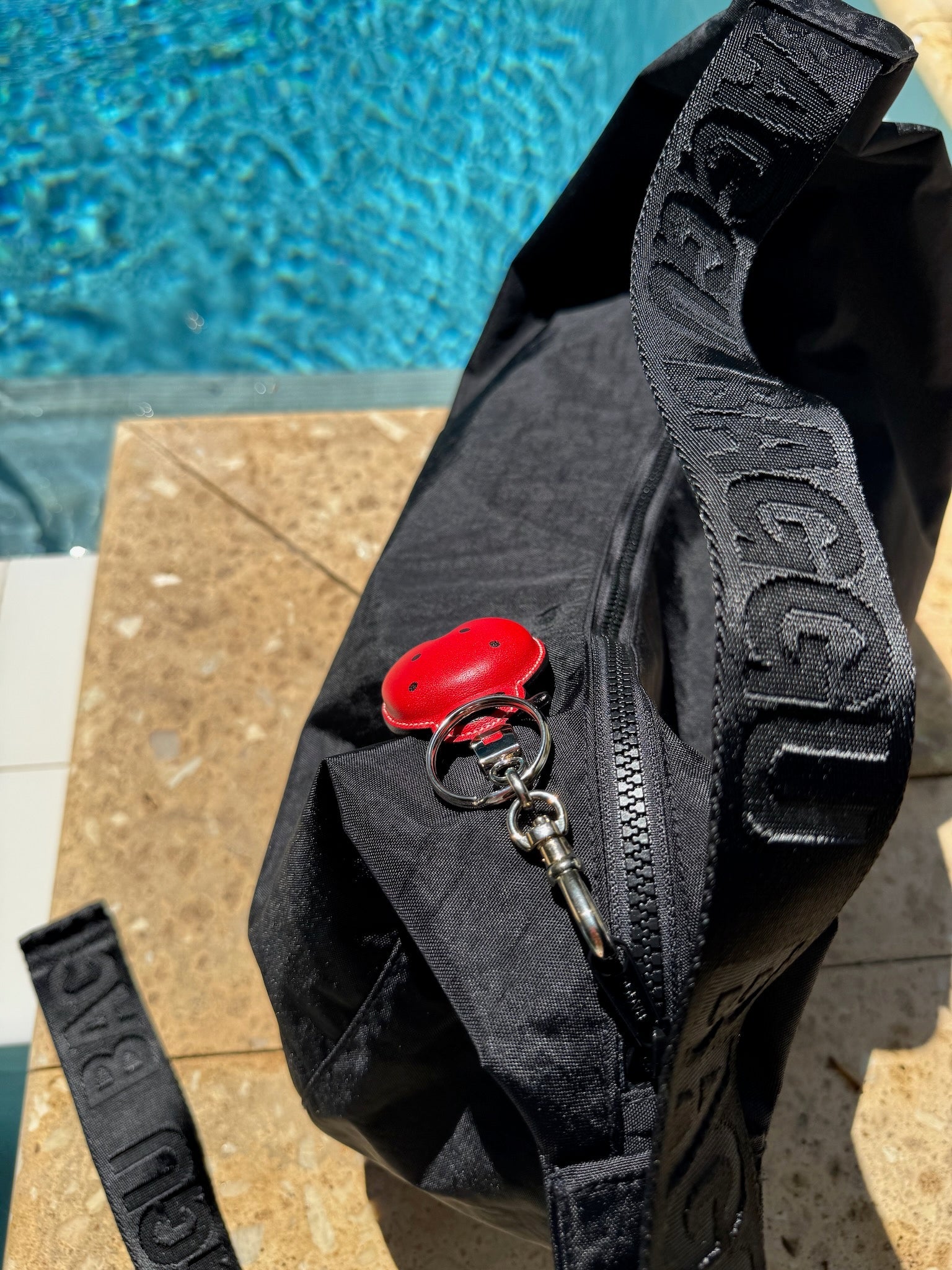 Red leather Ladybug Keychain Bag Charm on a large nylon black crossbody bag- ANNIE.G