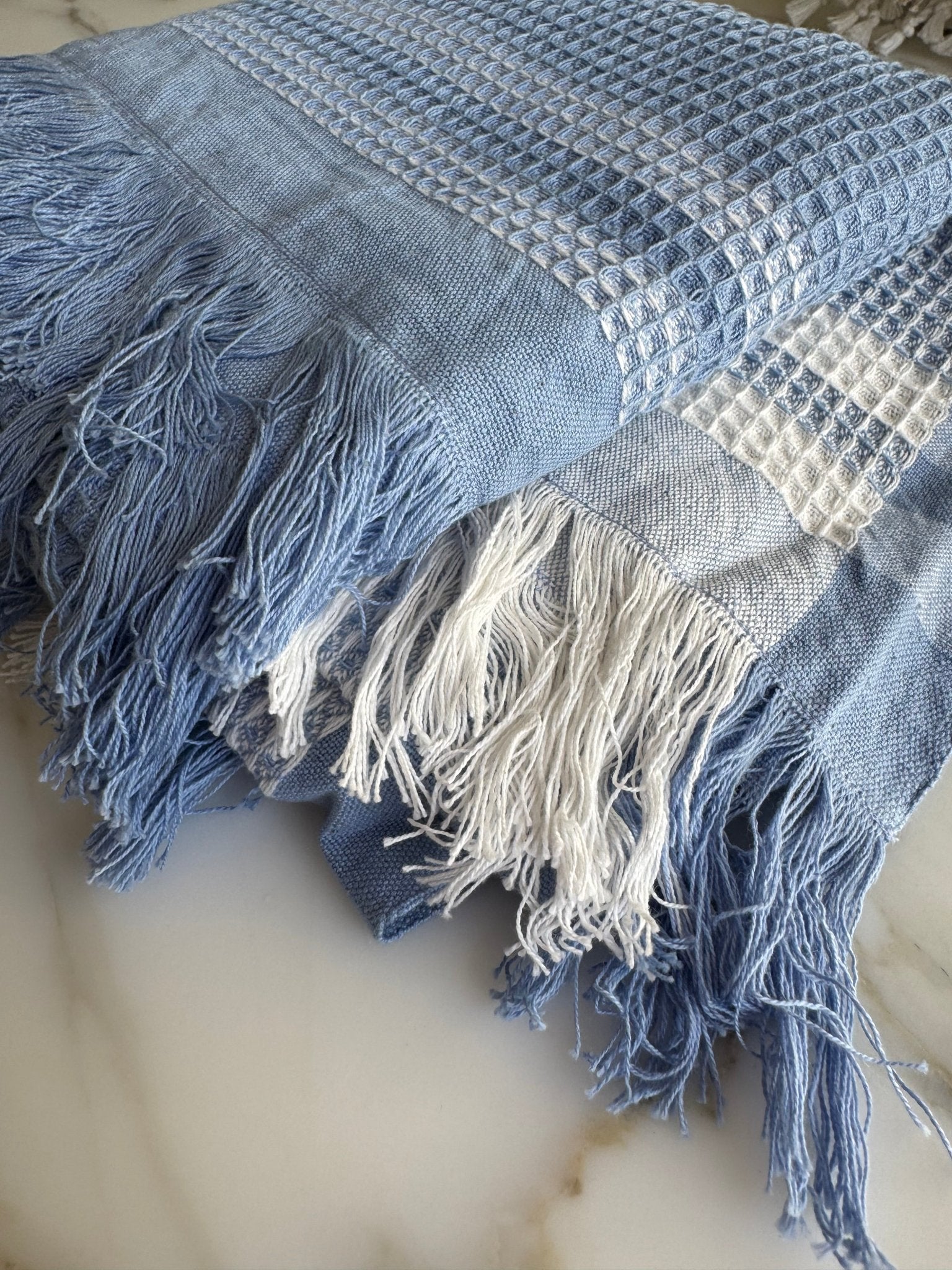 Folded Periwinkle Border Waffle Towel with a fringe edge - ANNIE.G