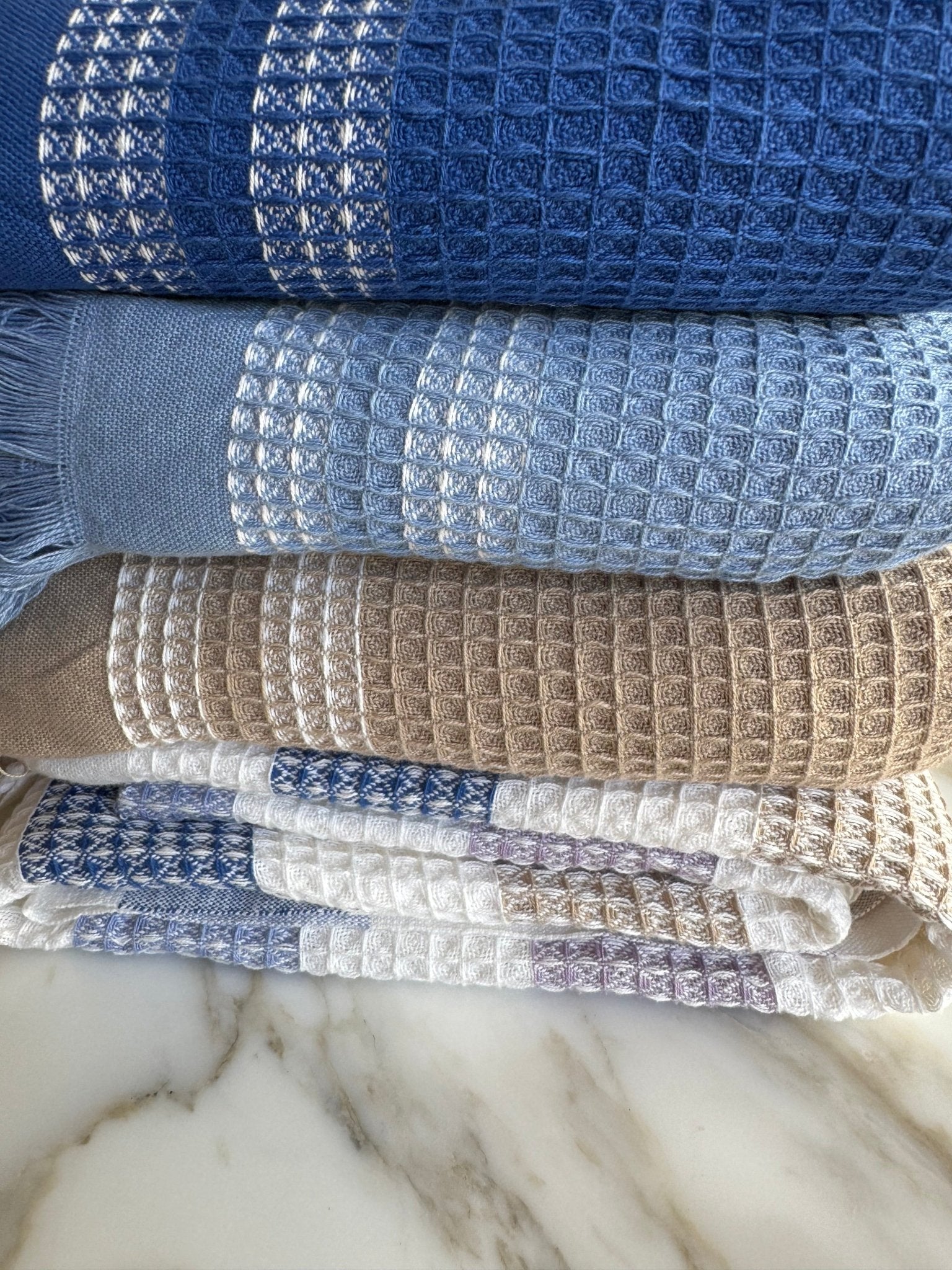Stack of folded handwoven waffle border  Towels - ANNIE.G
