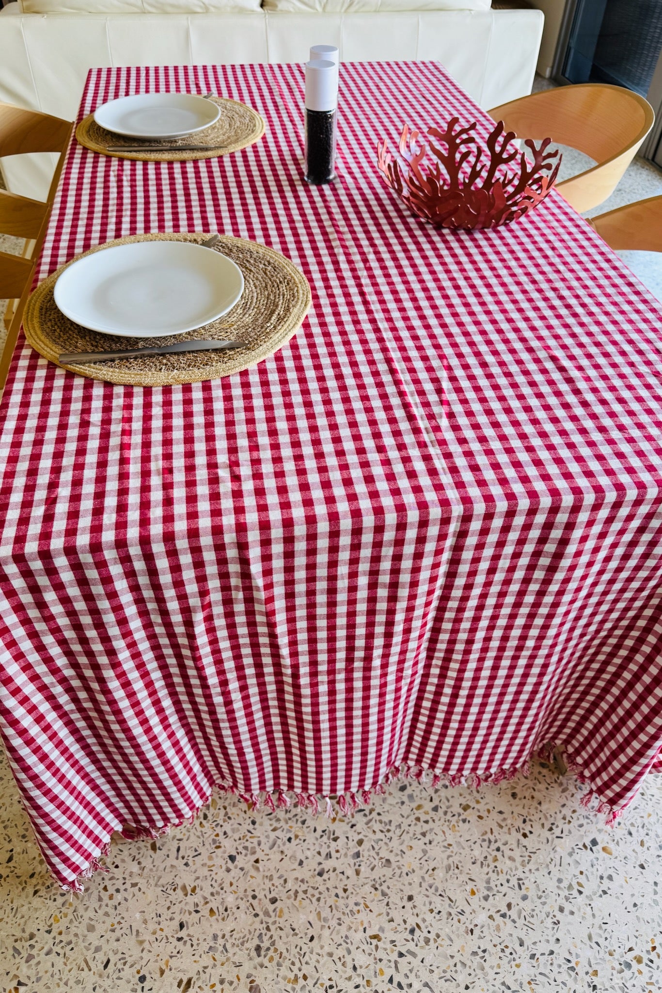 red-gingham-cotton-tablecloth-on-table-set-for-a-casual-meal