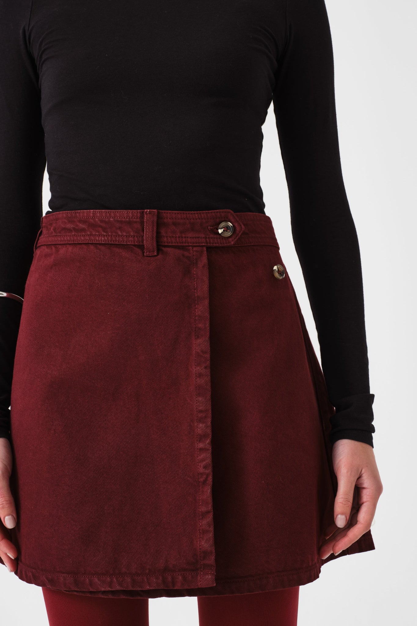 Mulberry mini wrap skirt worn by a person with black top