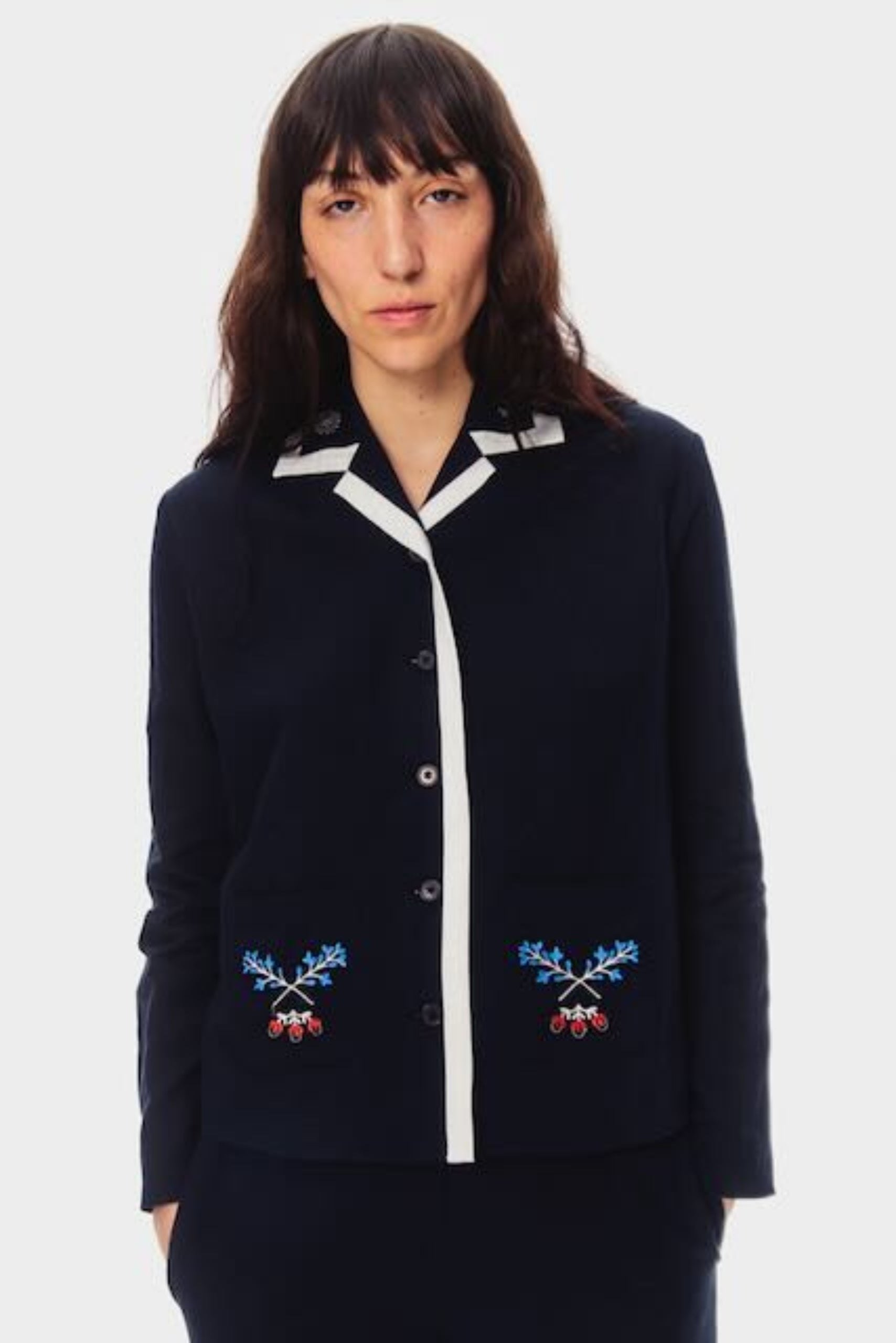 Woman in navy blue embroidered long sleeve buttoned shirt and long pants pyjamas set with white bias binding trim - ANNIE.G