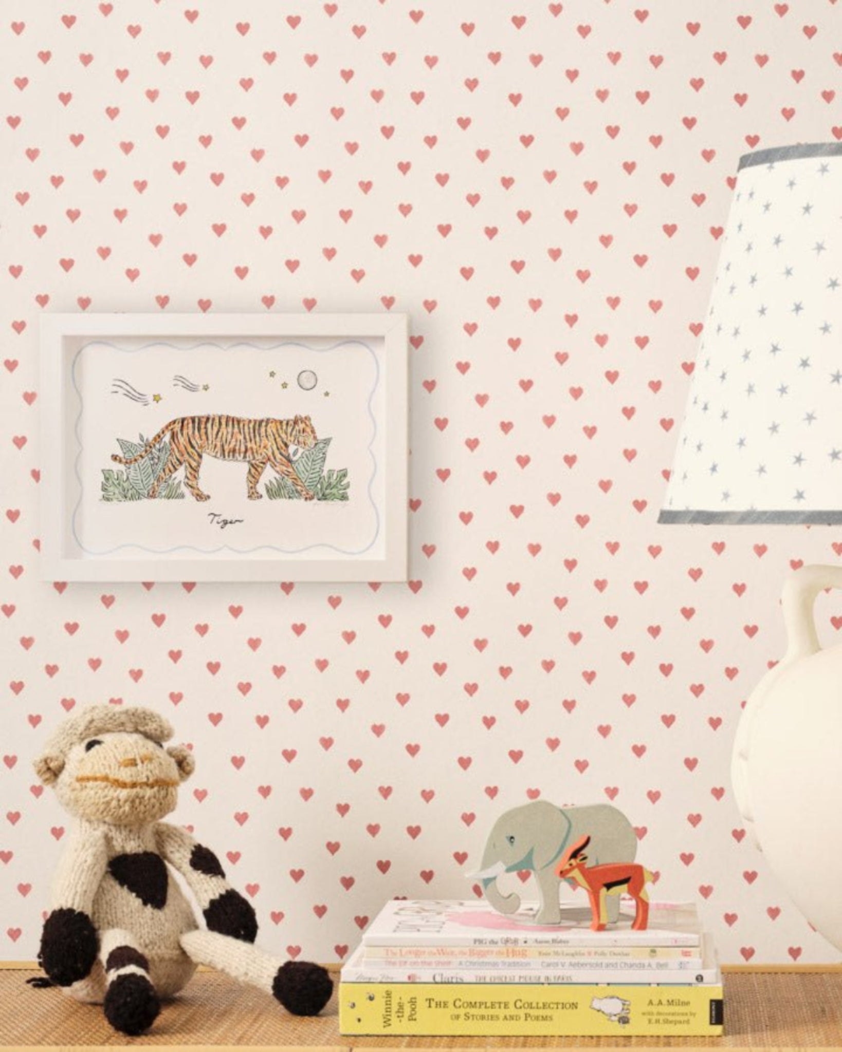 Watercolour Tiger Print in a white frame on a nursery wall with toys and lamp around - ANNIE.G