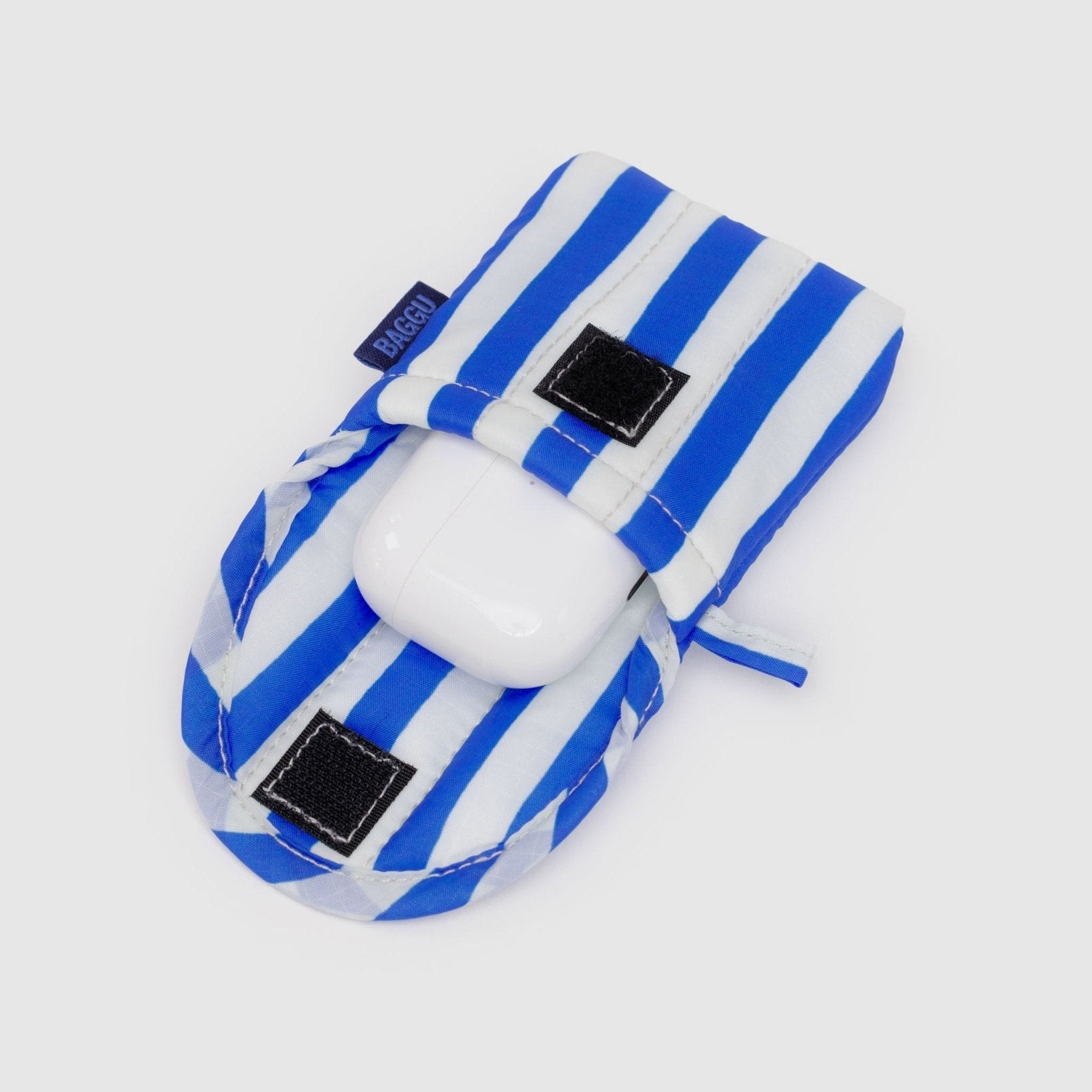 Earbuds white case inside a blue stripe pouch with velcro closure and hanging loop at side.