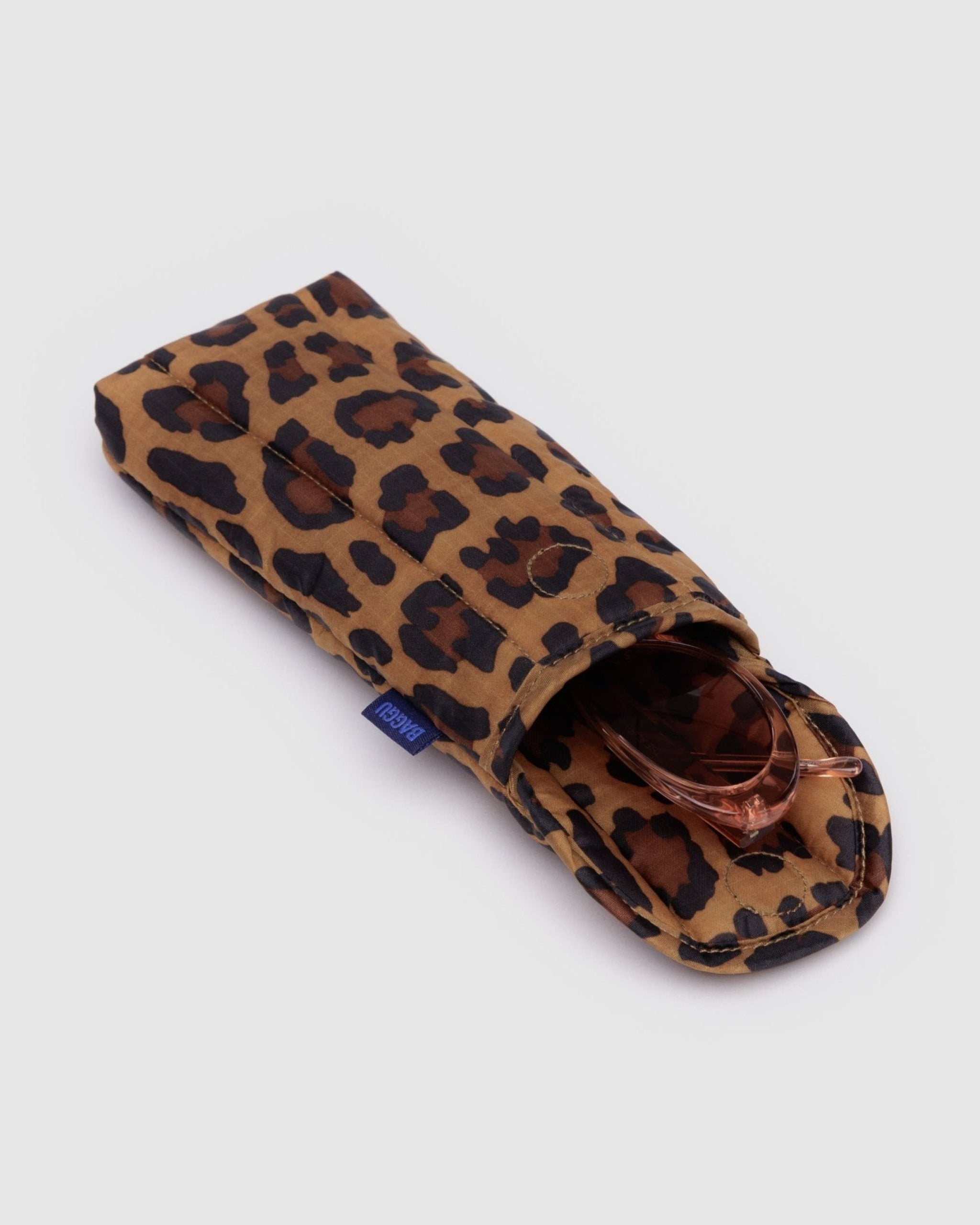 Open top magnetic flap of Puffy Glasses Sleeve in leopard print with glasses inside - ANNIE.G