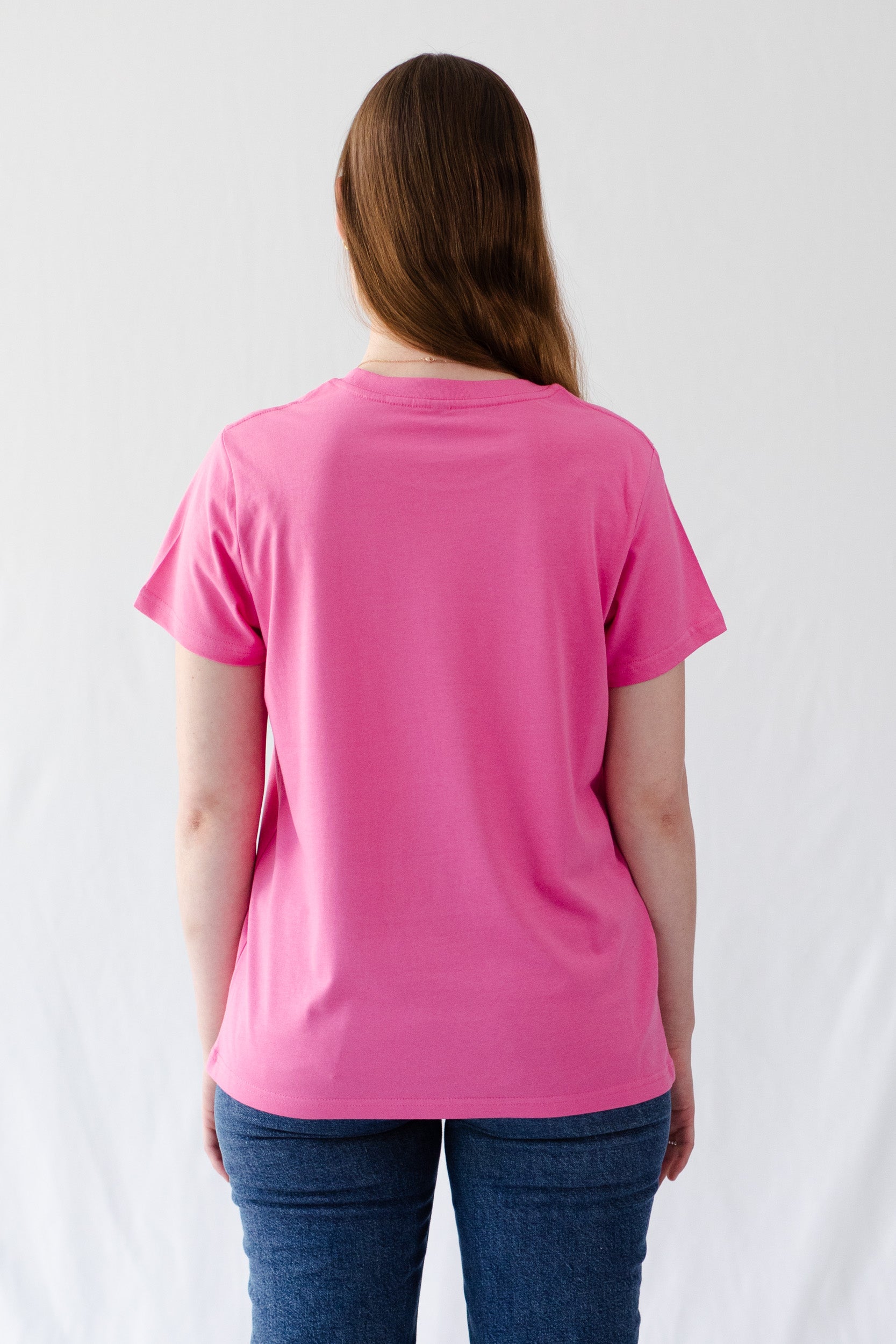 back-of-woman-wearing-camo-womens-AG-running-t-shirt-in-charity_pink-and-denim-jeans