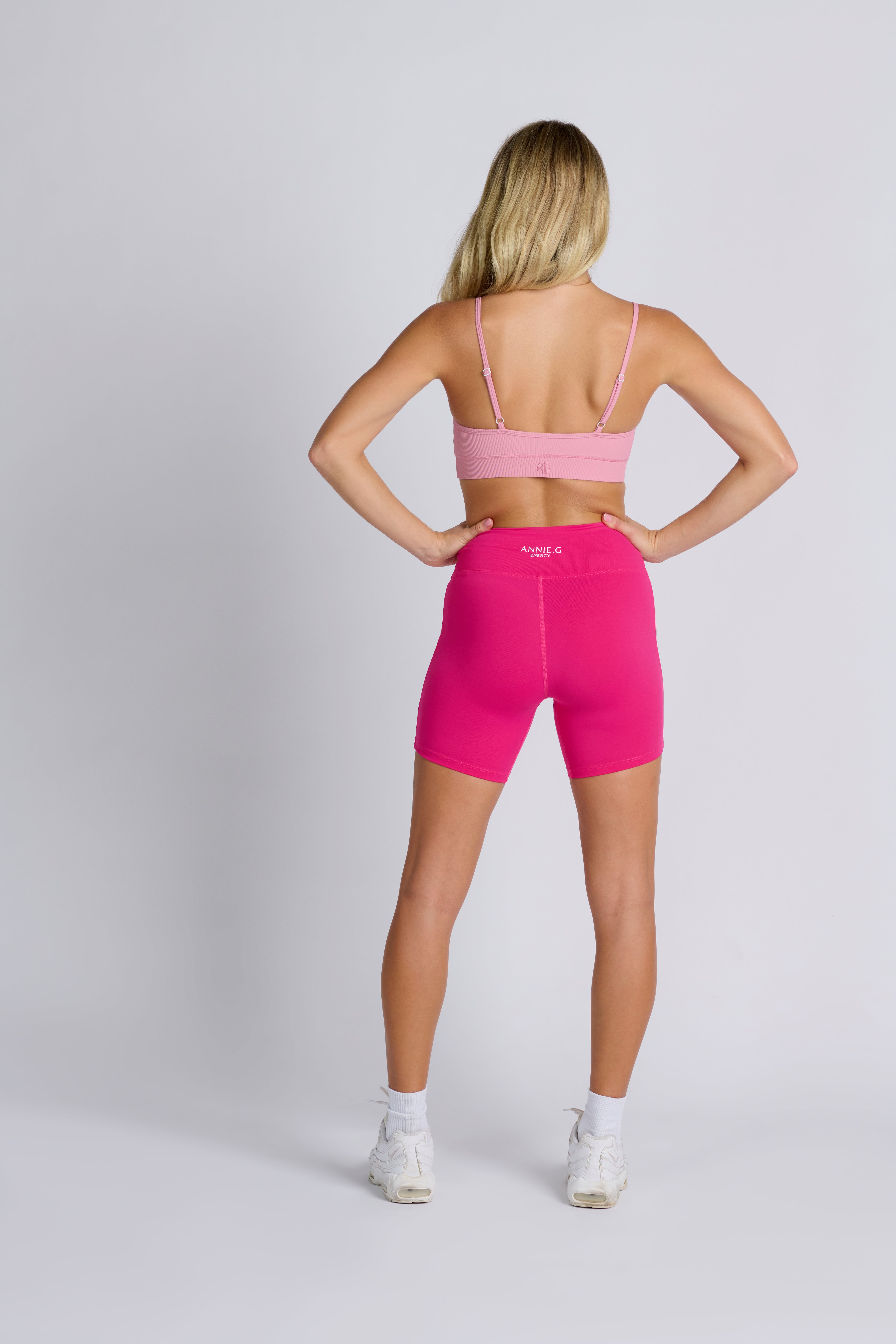 Girl's-back-wearing-pink-bike-shorts-and-pink-bra