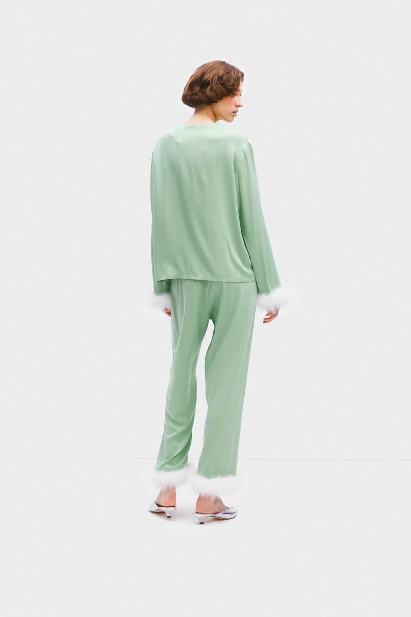 Back of woman wearing mint coloured pyjama top and pants set with white Detachable Feathers on cuffs - ANNIE.G