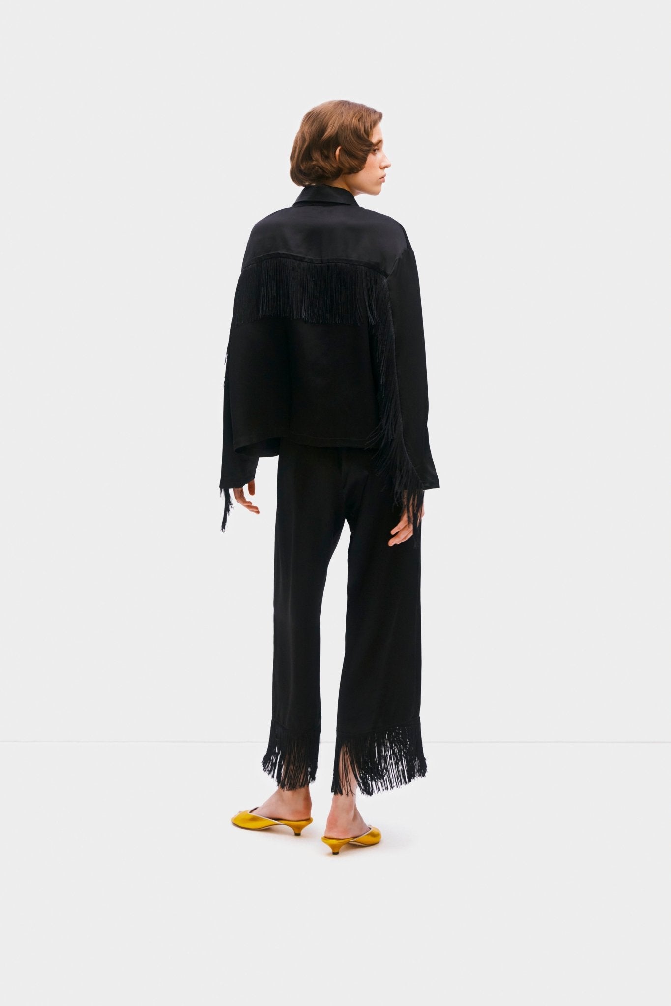Back of a person wearing shirt and pants with fringe detail of black Cosmic Cowboy Fringed Pyjama Set - ANNIE.G