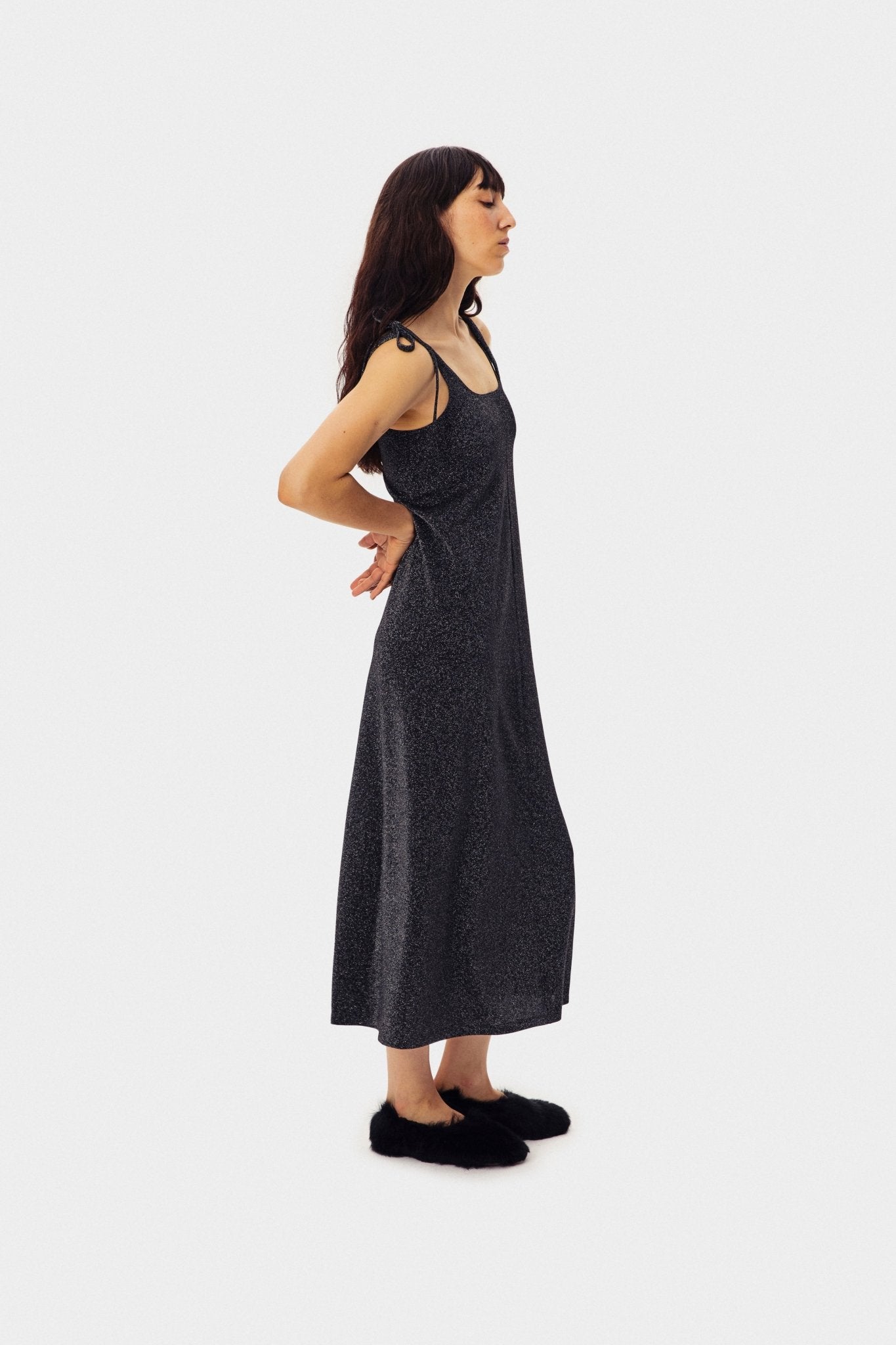 Side view of the Kylie Lurex Slip Dress in Black.