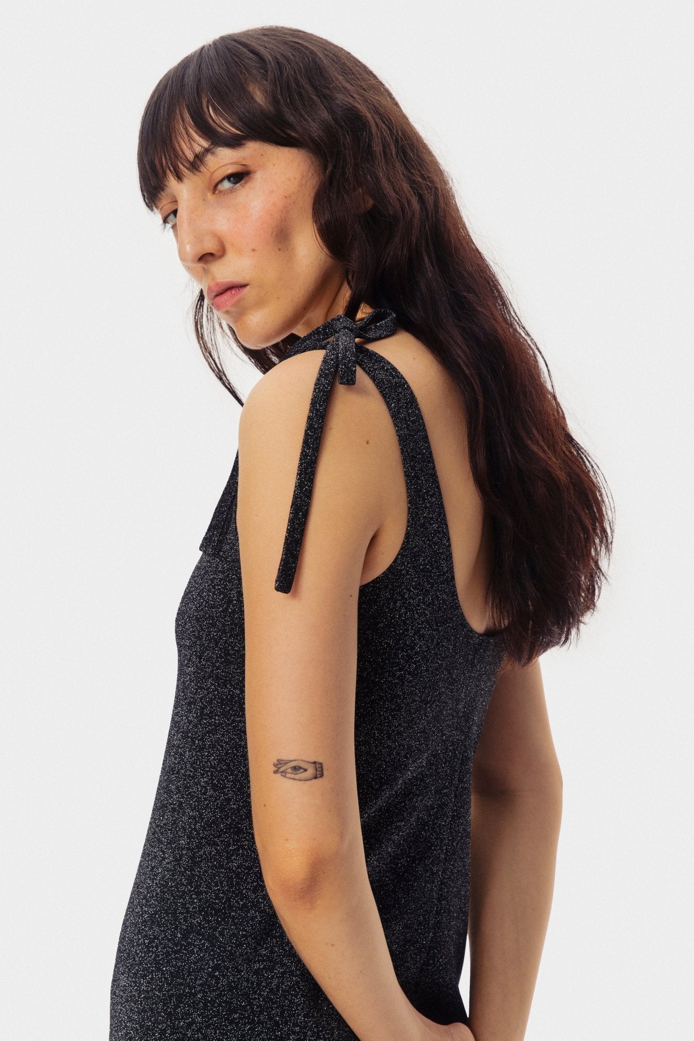 Scoop back of the black lurex slip dress