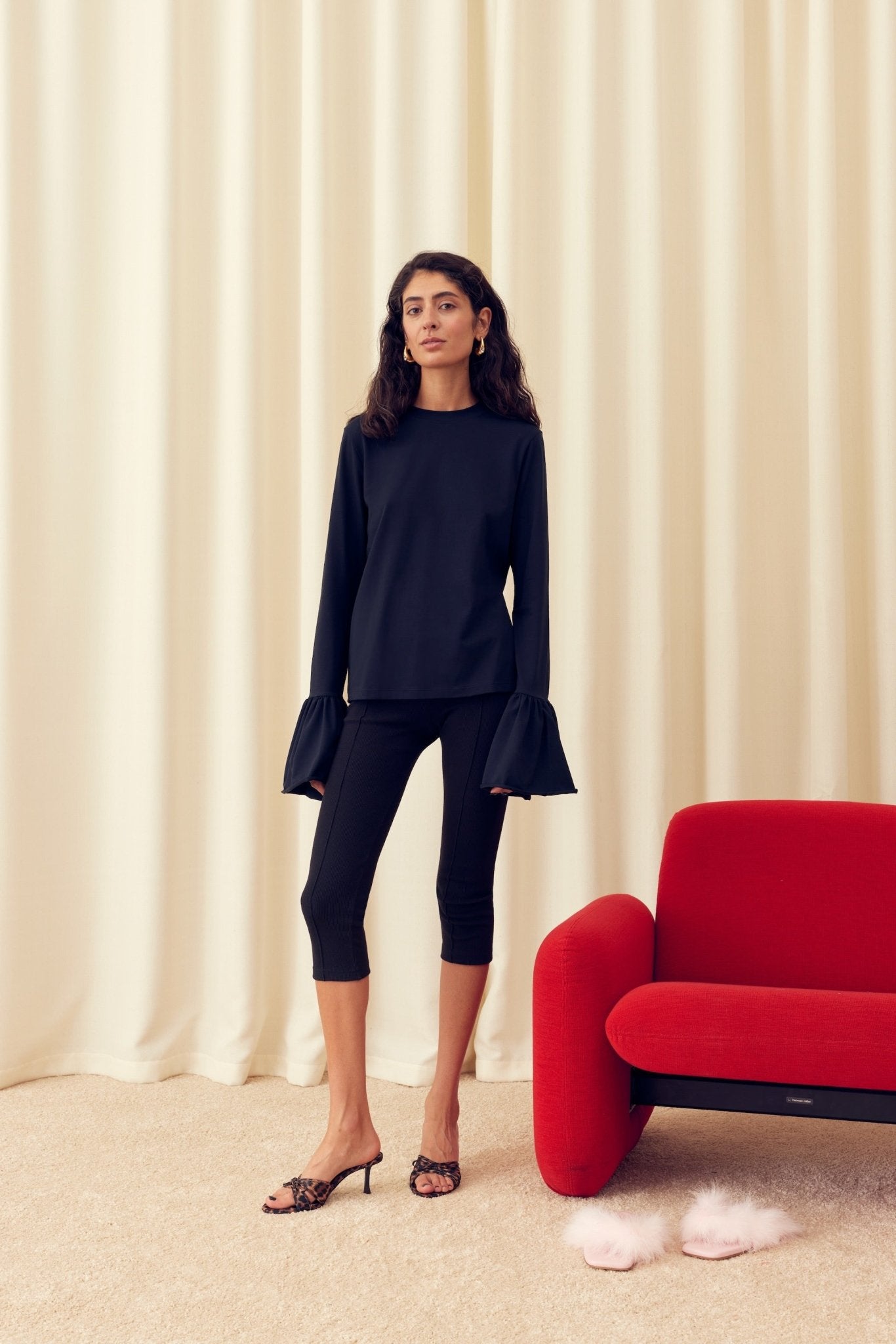 Woman wearing a black Ruffled Long Sleeve Stretch Cotton Jersey T-shirt and tights - ANNIE.G